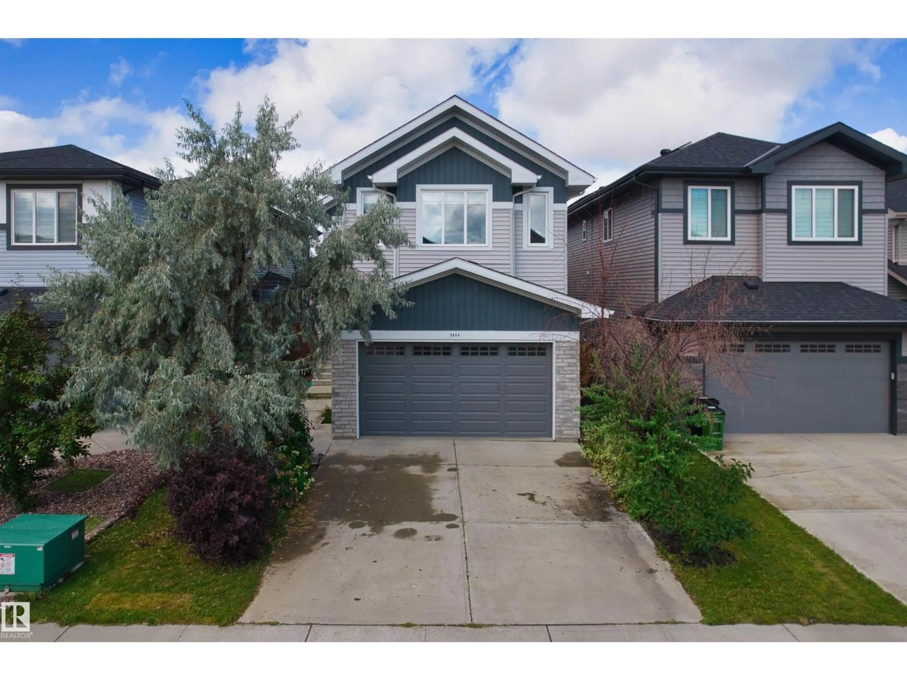Home with vinyl exterior material, street for 9804 223 ST, Edmonton Alberta T5T7B6