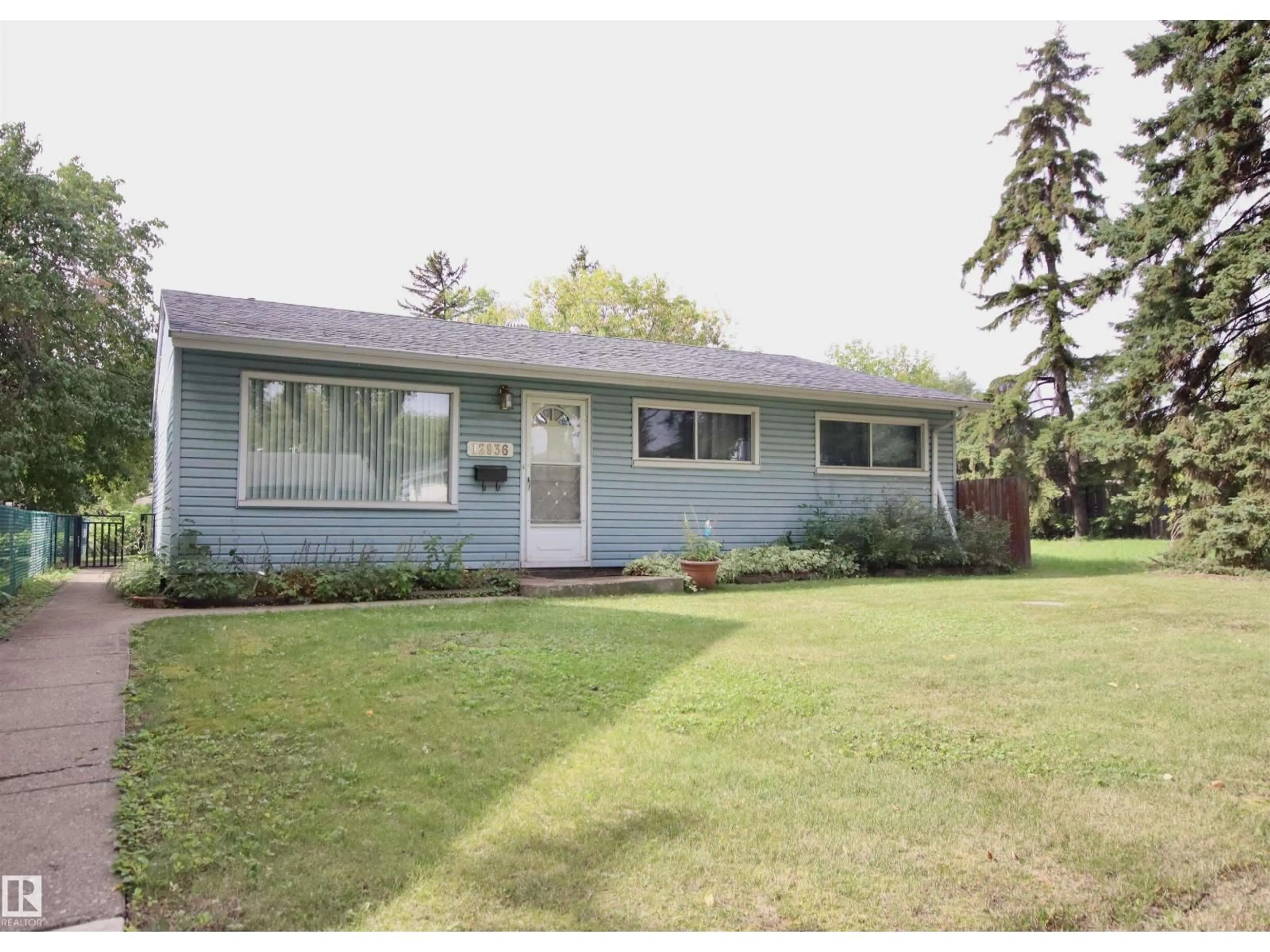 Home with vinyl exterior material, street for NW - 12936 115 ST, Edmonton Alberta T5E5G1