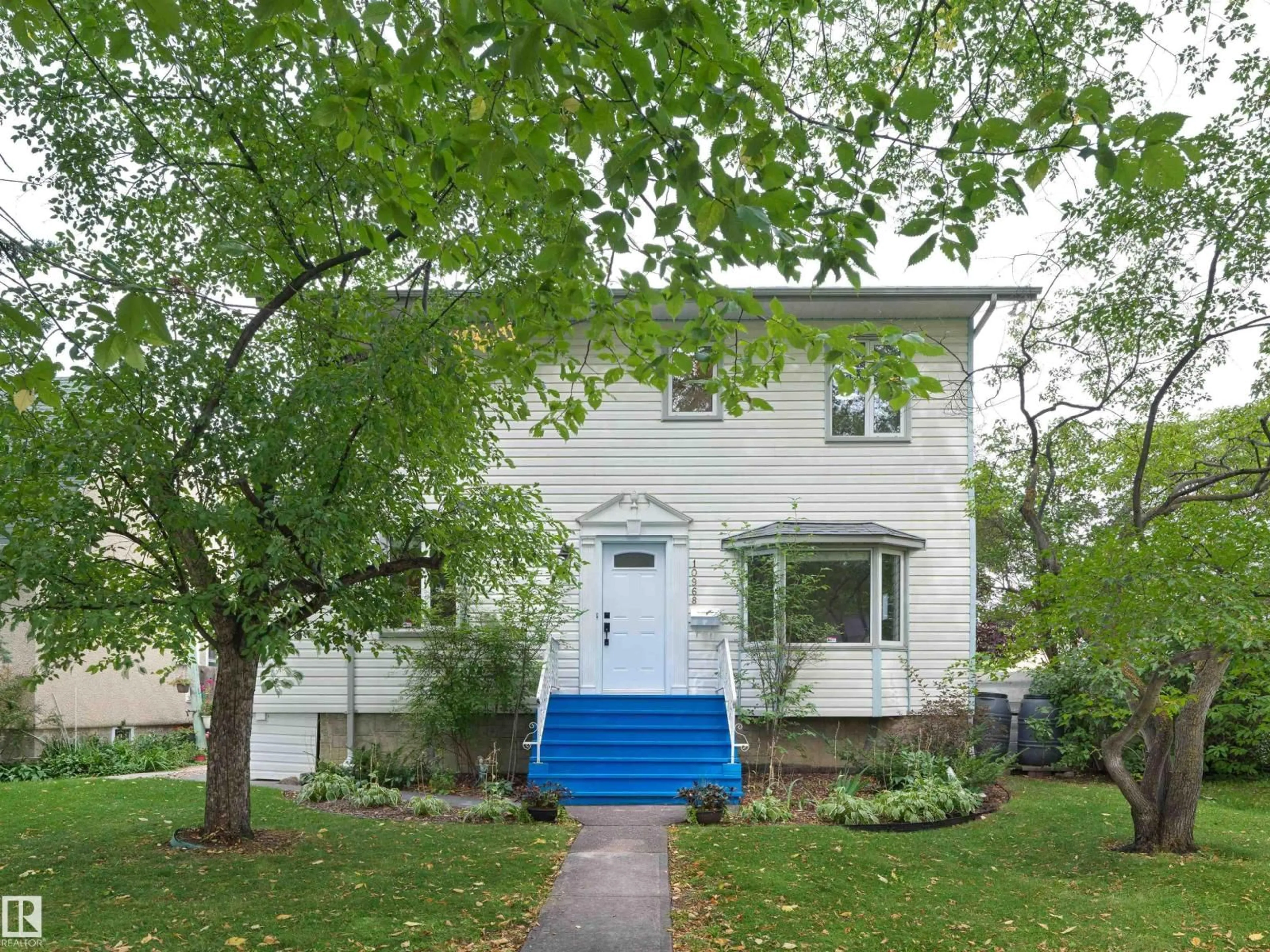 Home with vinyl exterior material, street for 10968 75 AV, Edmonton Alberta T6G0G9