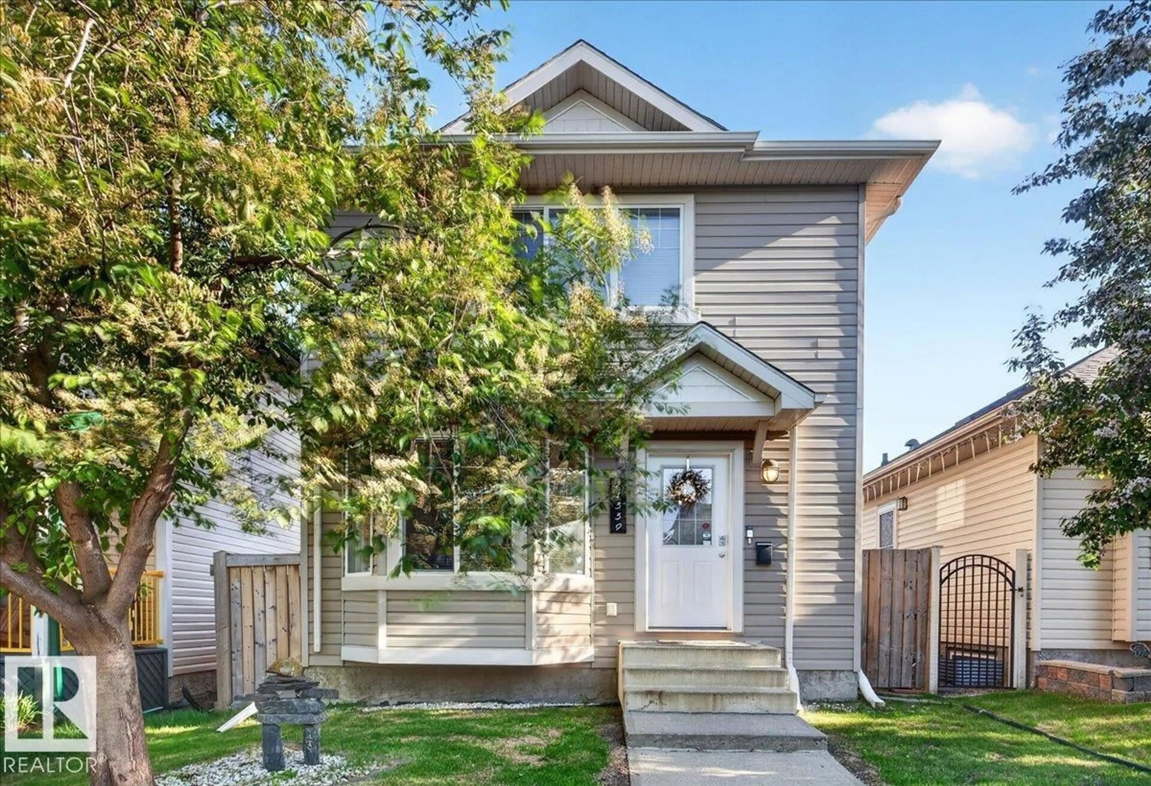 Home with vinyl exterior material, street for 21339 91 AV, Edmonton Alberta T5T6Y9