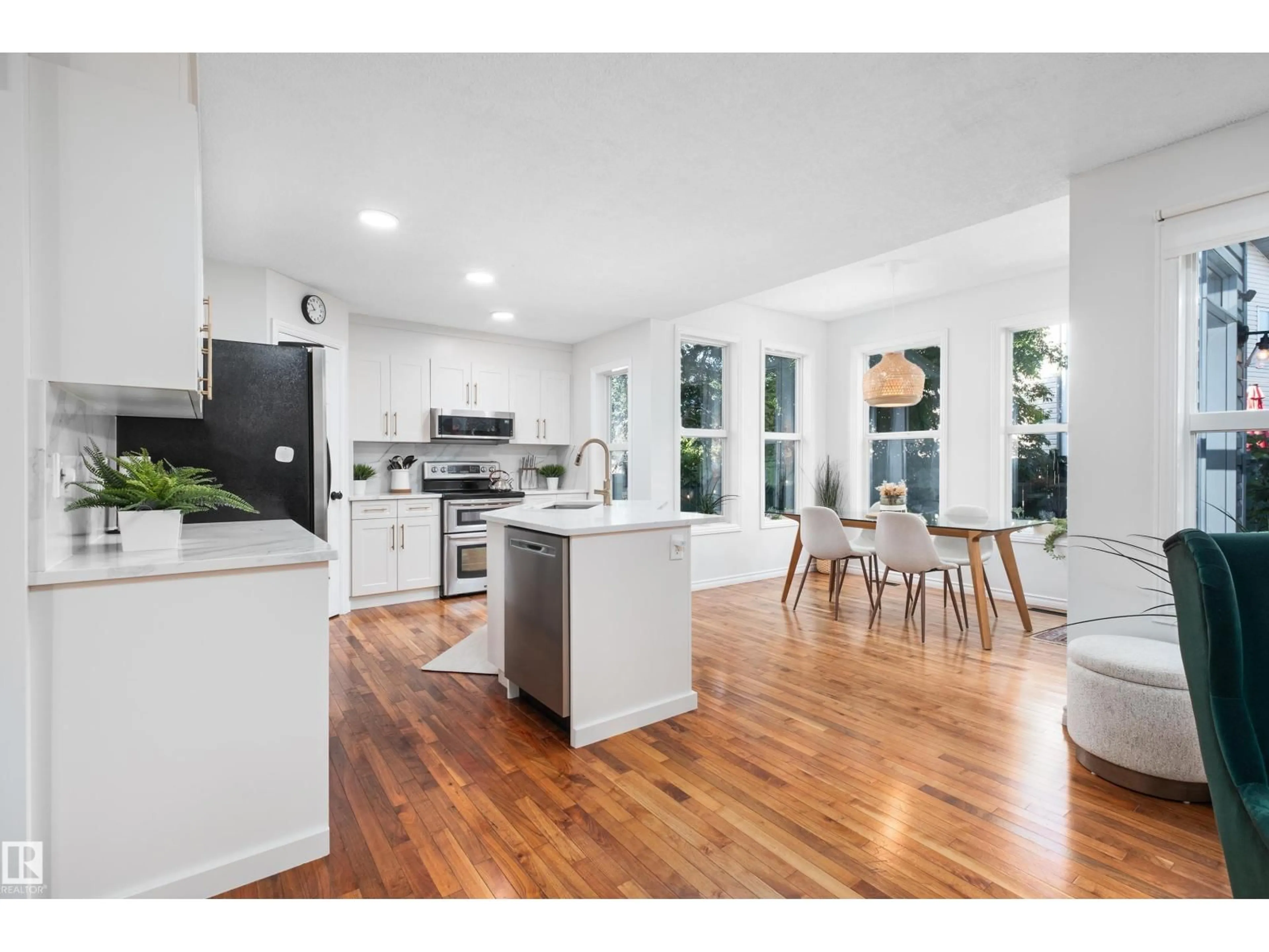 Open concept kitchen, wood/laminate floor for 1128 114 ST, Edmonton Alberta T6W1P6