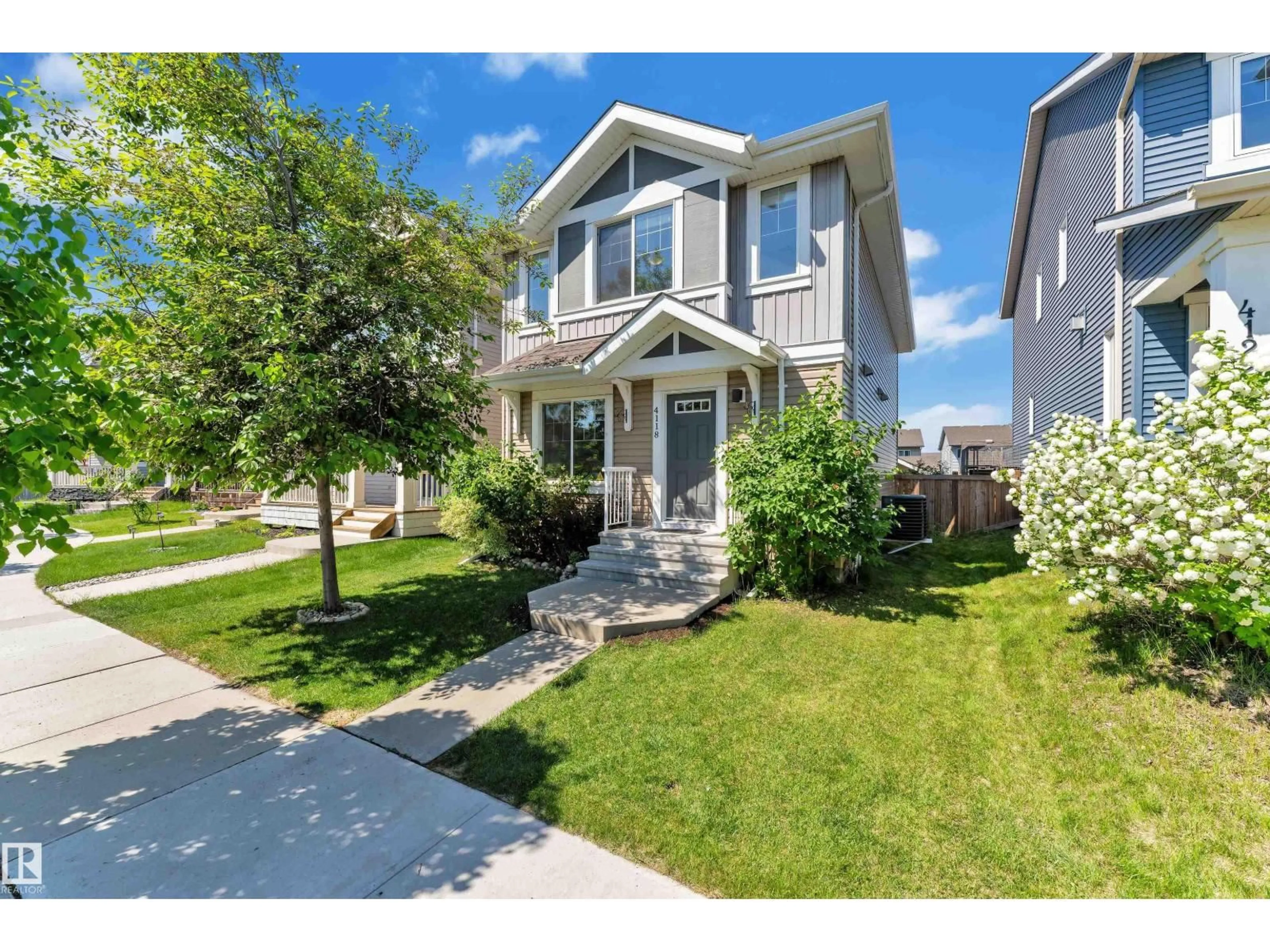 Home with vinyl exterior material, street for NW - 4118 6A ST, Edmonton Alberta T6T0T6