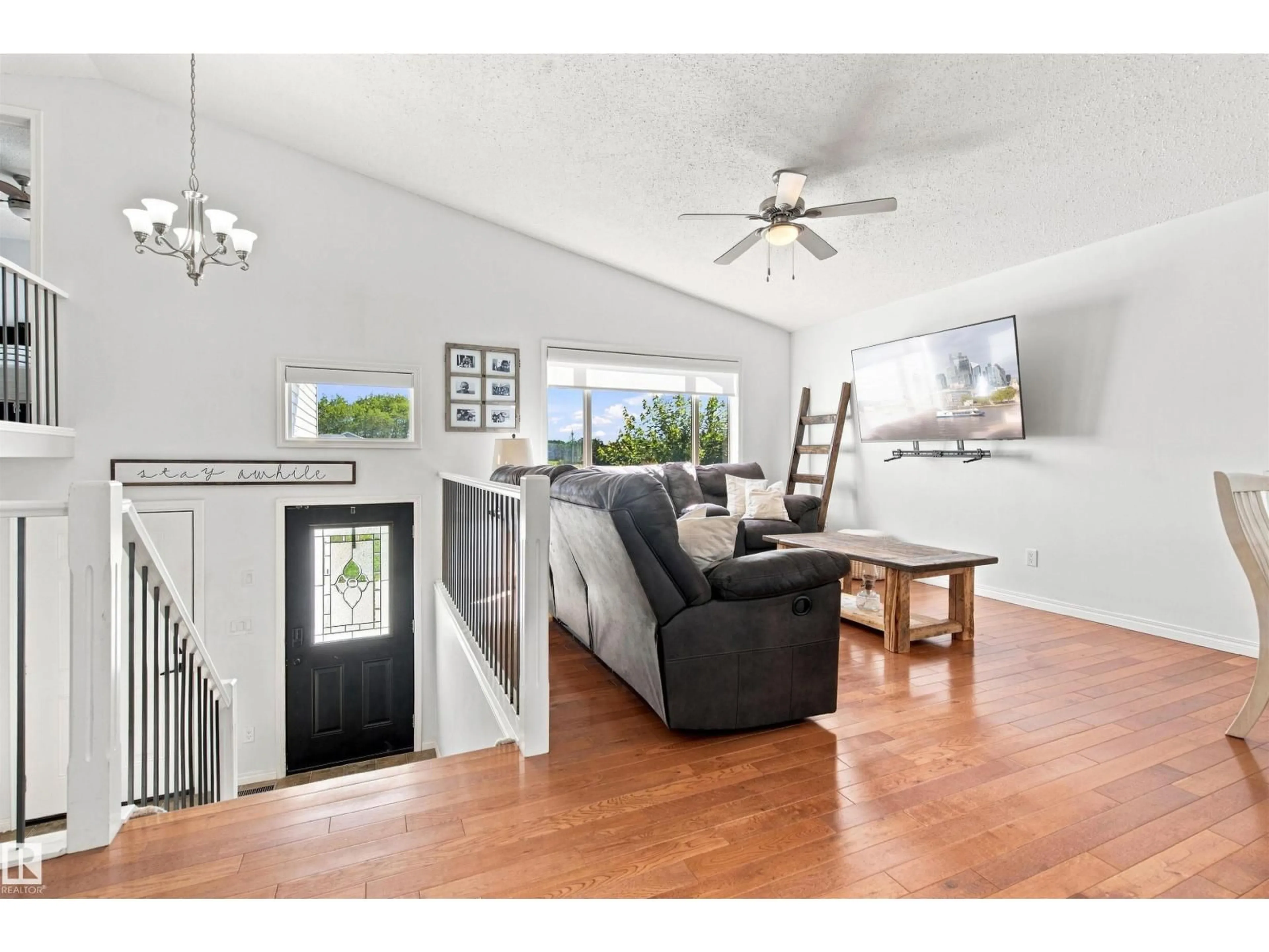 Living room with furniture, wood/laminate floor for 4906 PARK CR, Cherry Grove Alberta T0A0T0