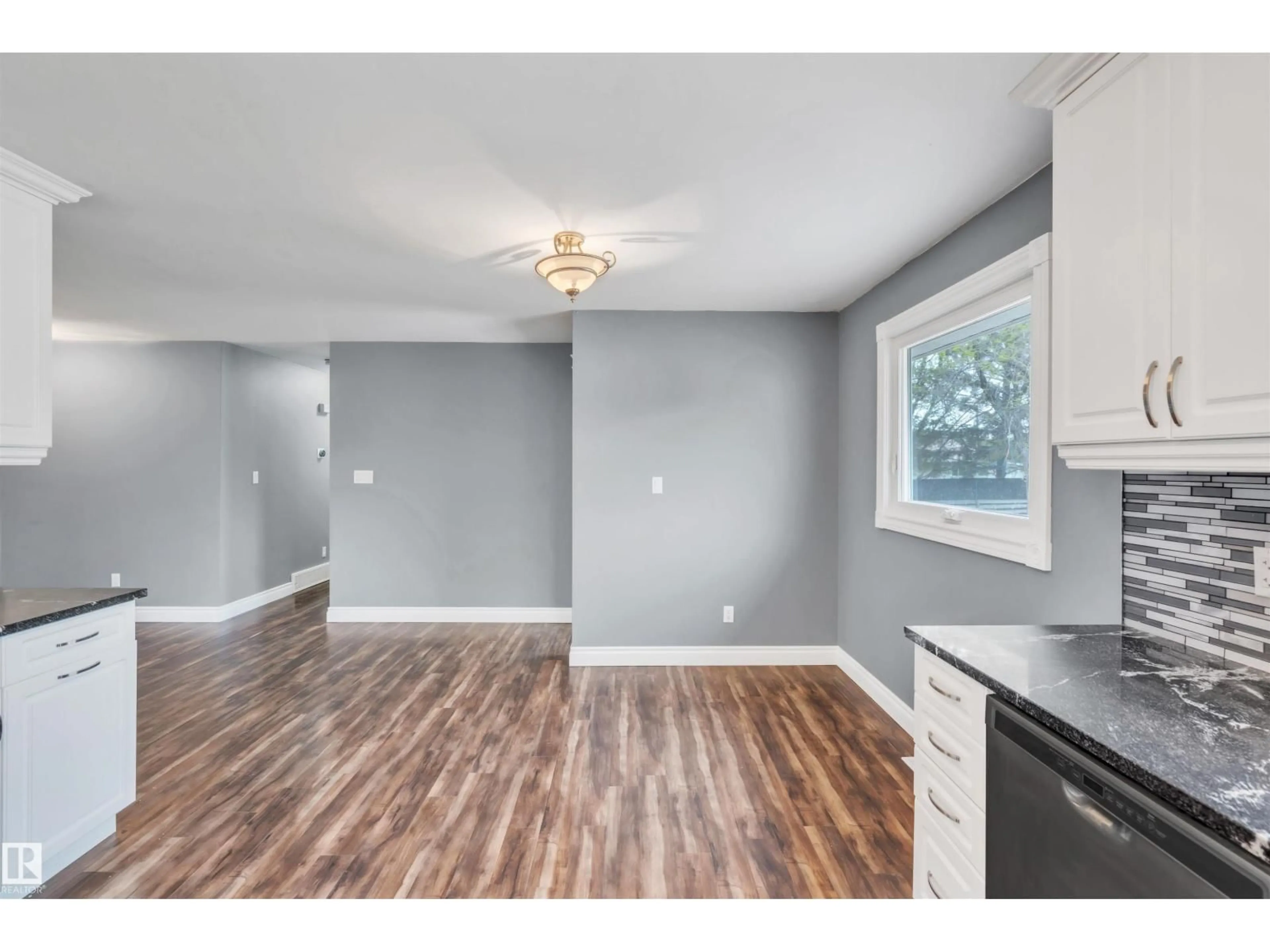 Open concept kitchen, wood/laminate floor for 61314 - 405 RR 463, Rural Bonnyville M.D. Alberta T9N2G9