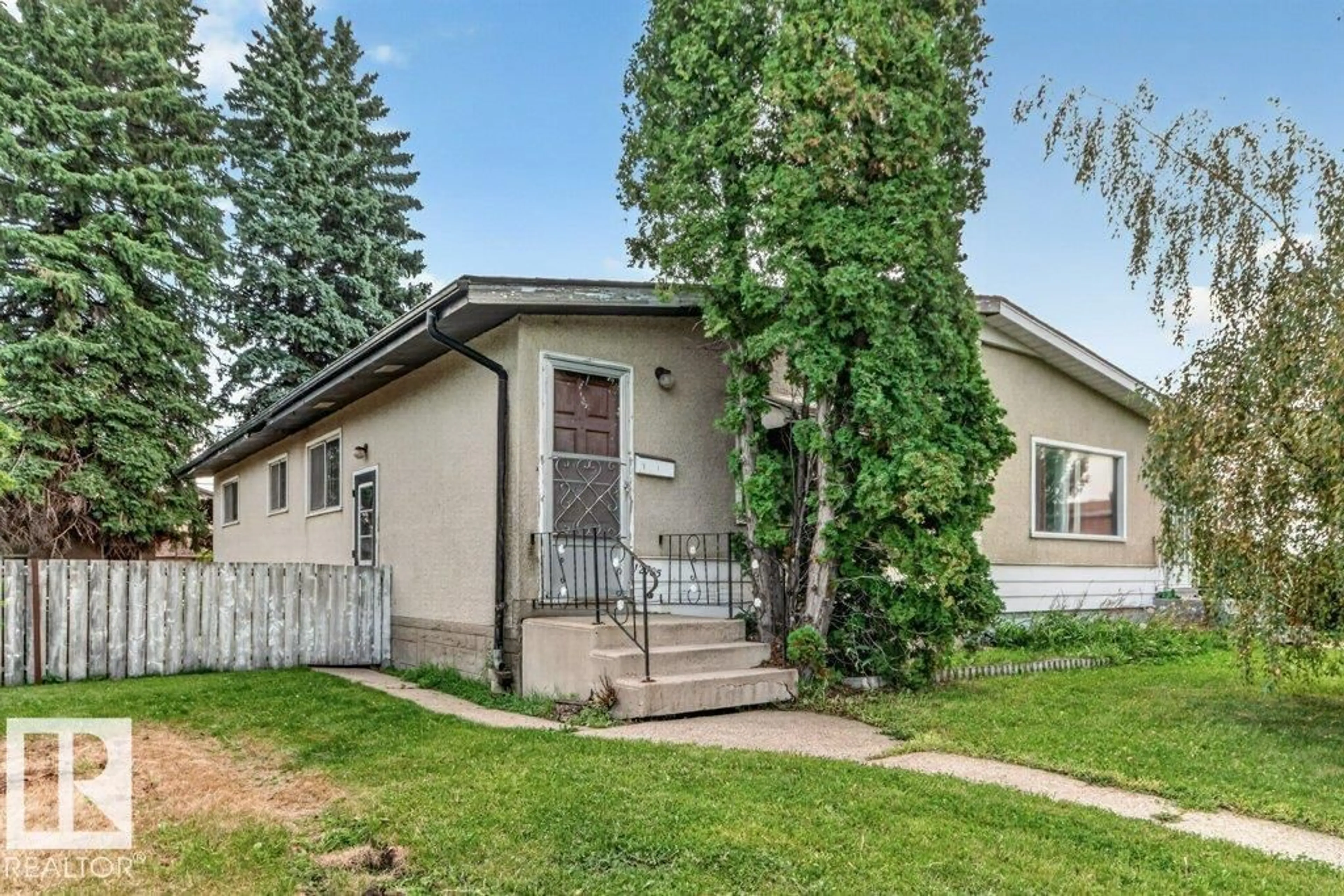 Home with vinyl exterior material, street for 12705 87 ST, Edmonton Alberta T5E3C8