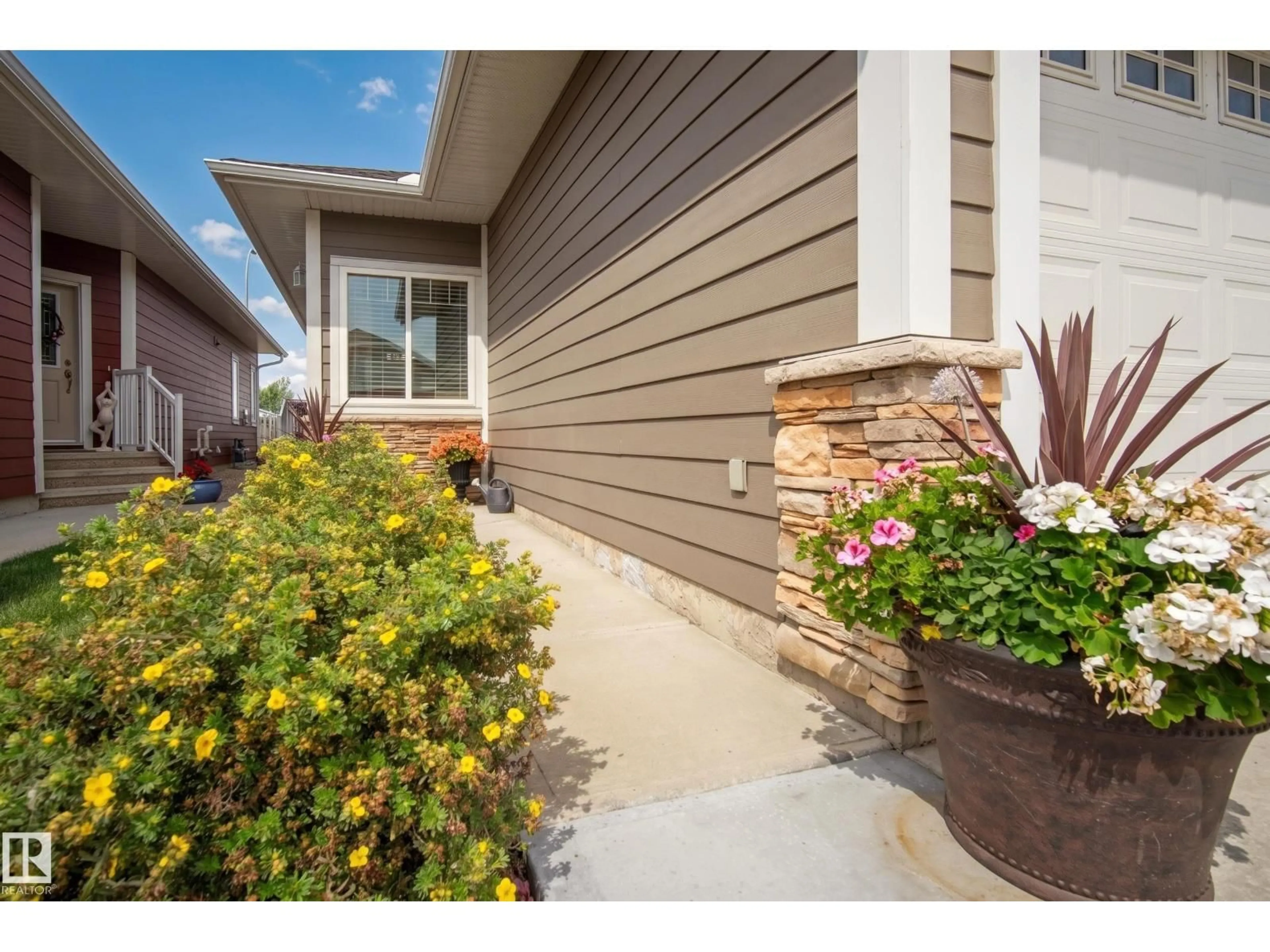 Home with vinyl exterior material, street for #9 - 175 MCCONACHIE DR, Edmonton Alberta T5Y0S1