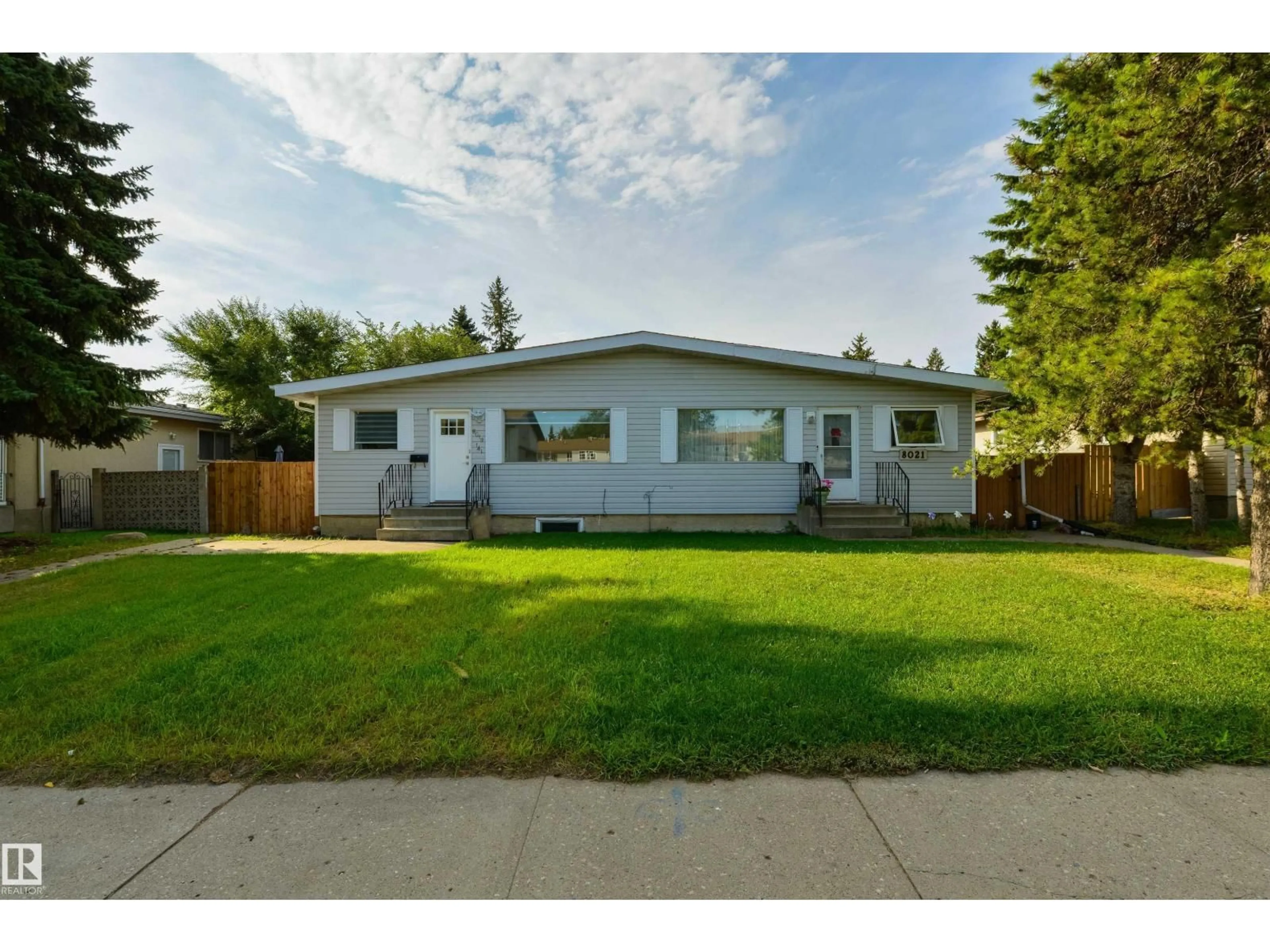 Home with vinyl exterior material, street for 8019 141 AV, Edmonton Alberta T5C2N8