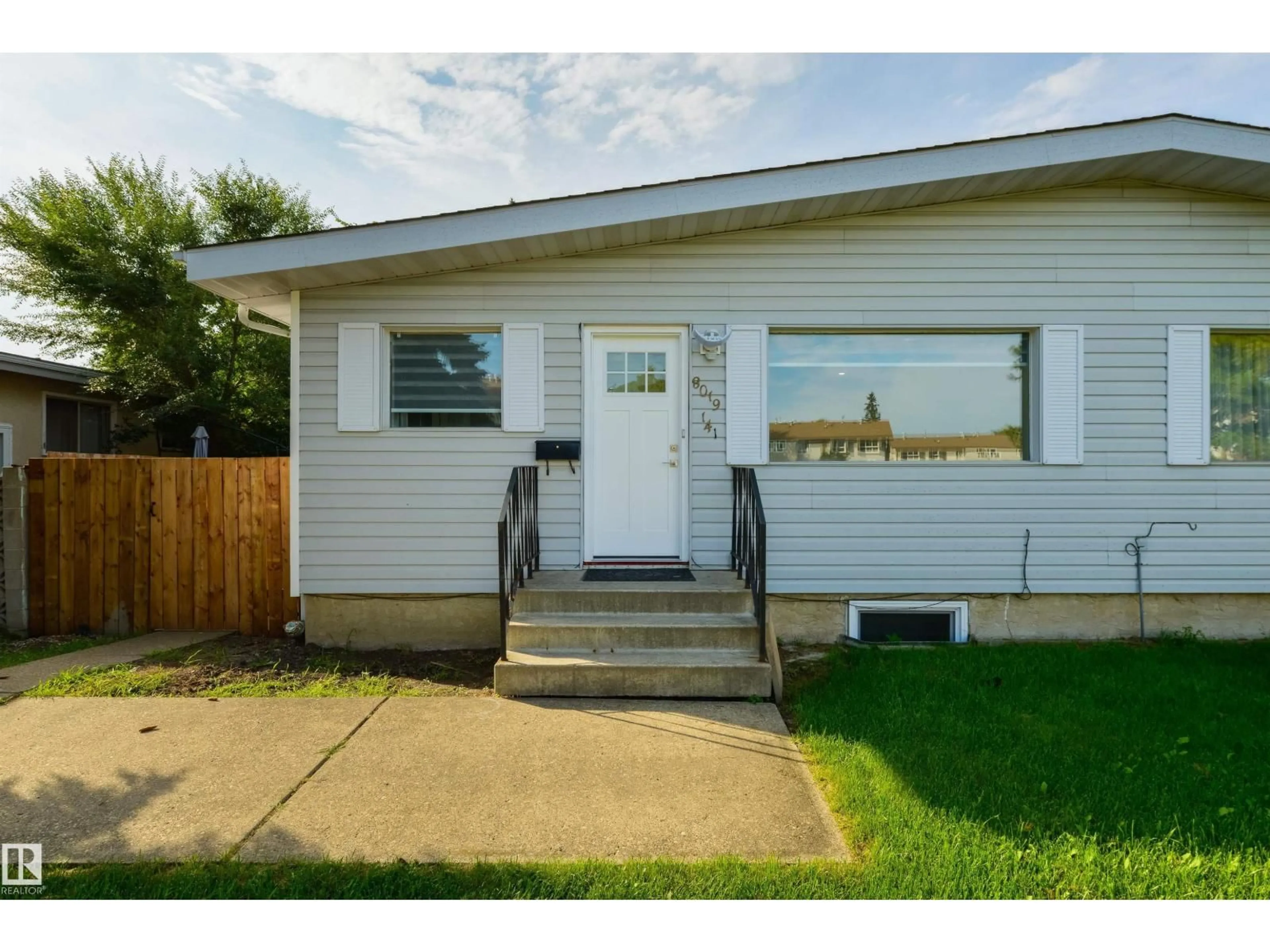 Home with vinyl exterior material, street for 8019 141 AV, Edmonton Alberta T5C2N8
