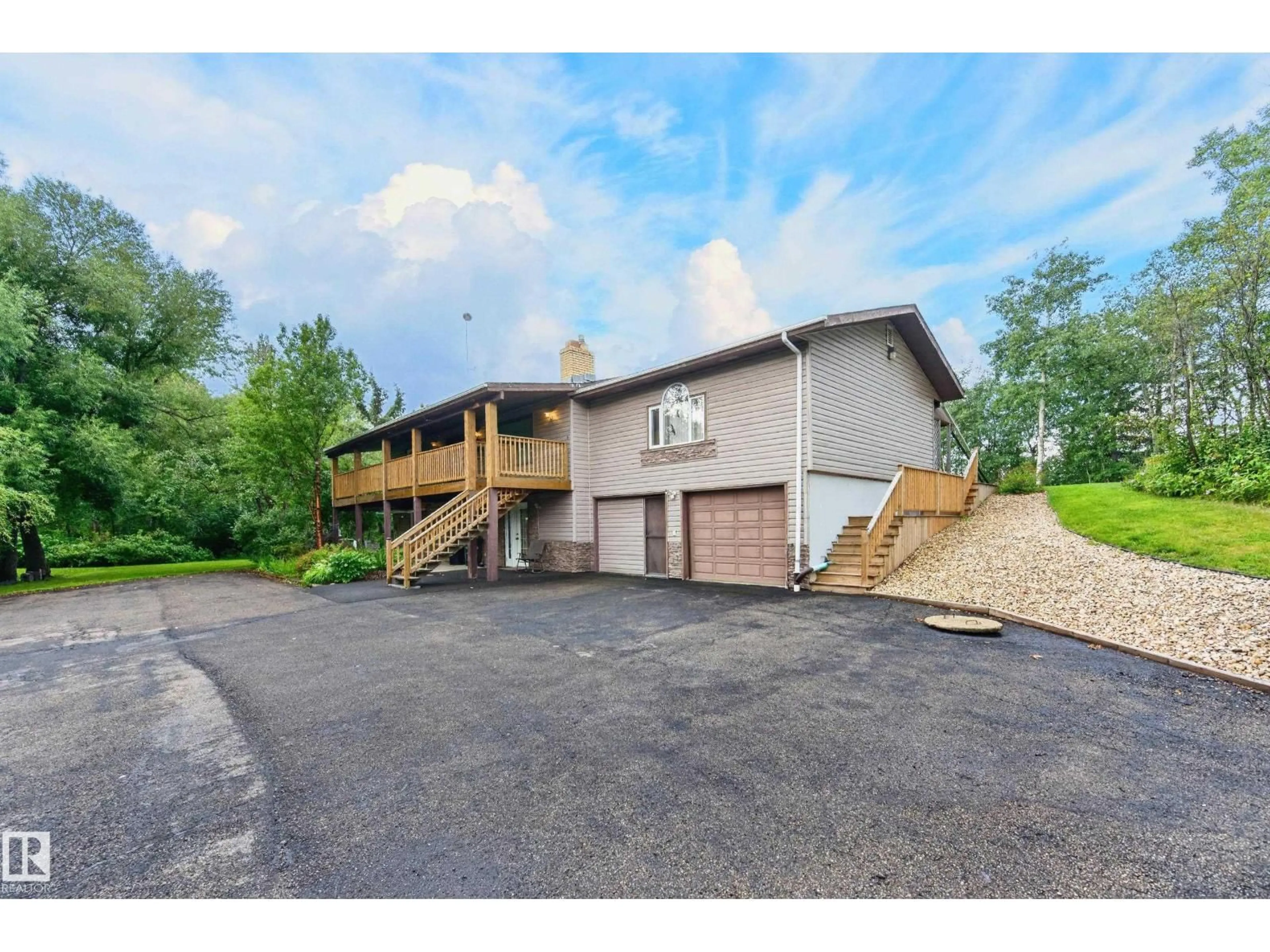 A pic from outside/outdoor area/front of a property/back of a property/a pic from drone, unknown for 206 - 52063 RGE ROAD 225, Rural Strathcona County Alberta T8C1C3