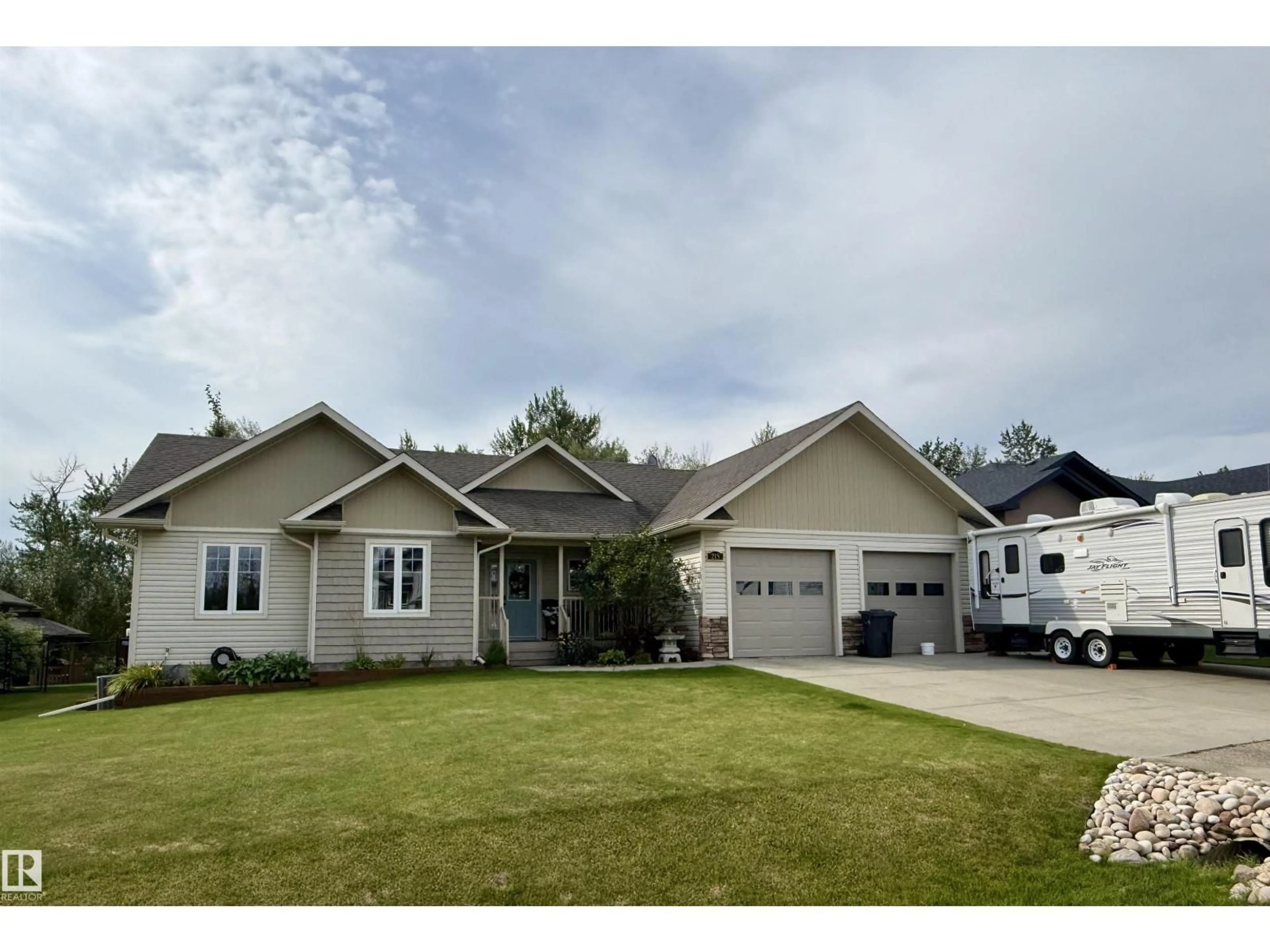 Home with vinyl exterior material, street for 215 RIVER RAVINE ESTATES, Rural Brazeau County Alberta T7A0B9