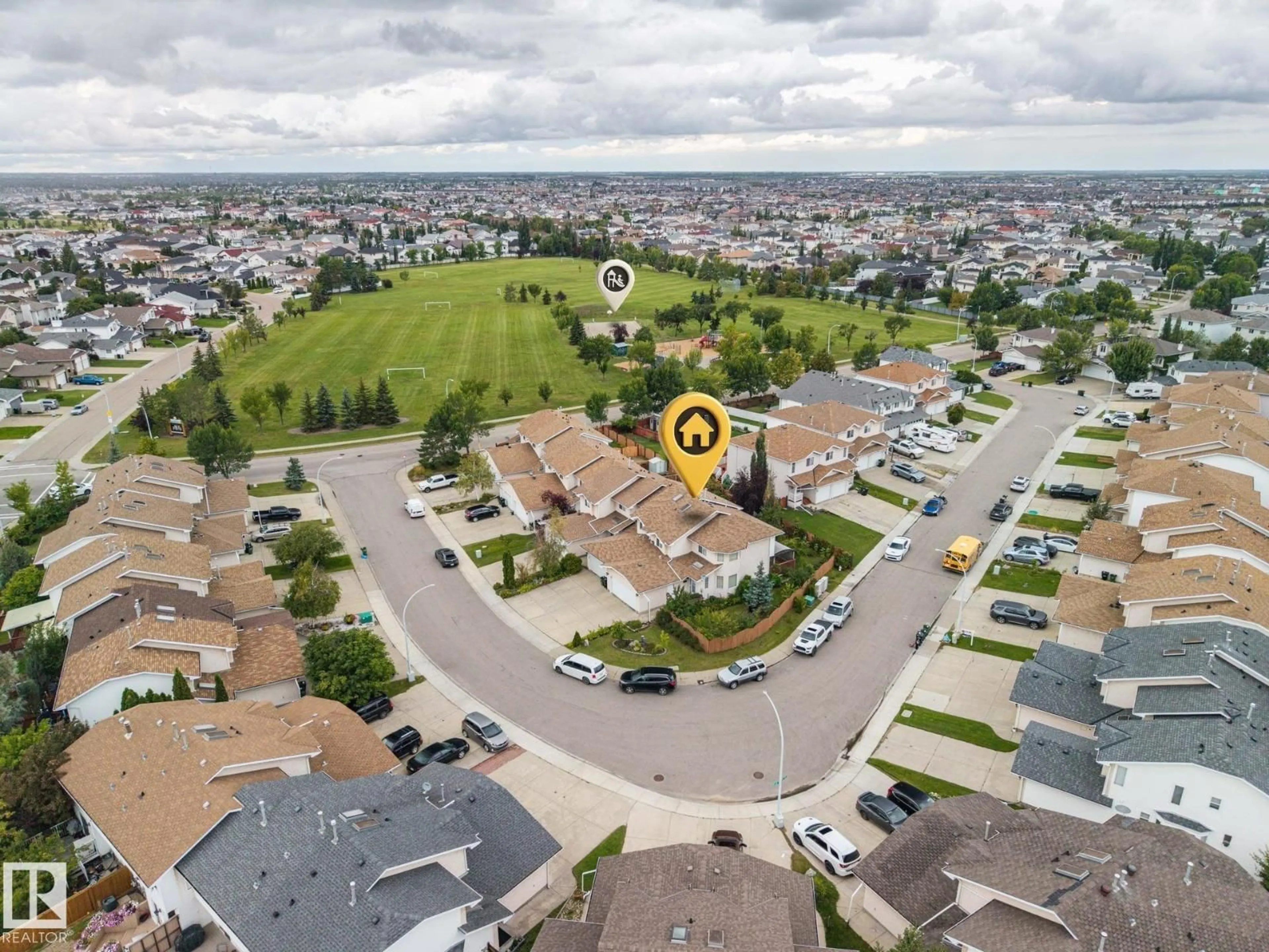 A pic from outside/outdoor area/front of a property/back of a property/a pic from drone, street for 6910 158A AV, Edmonton Alberta T5Z3A5