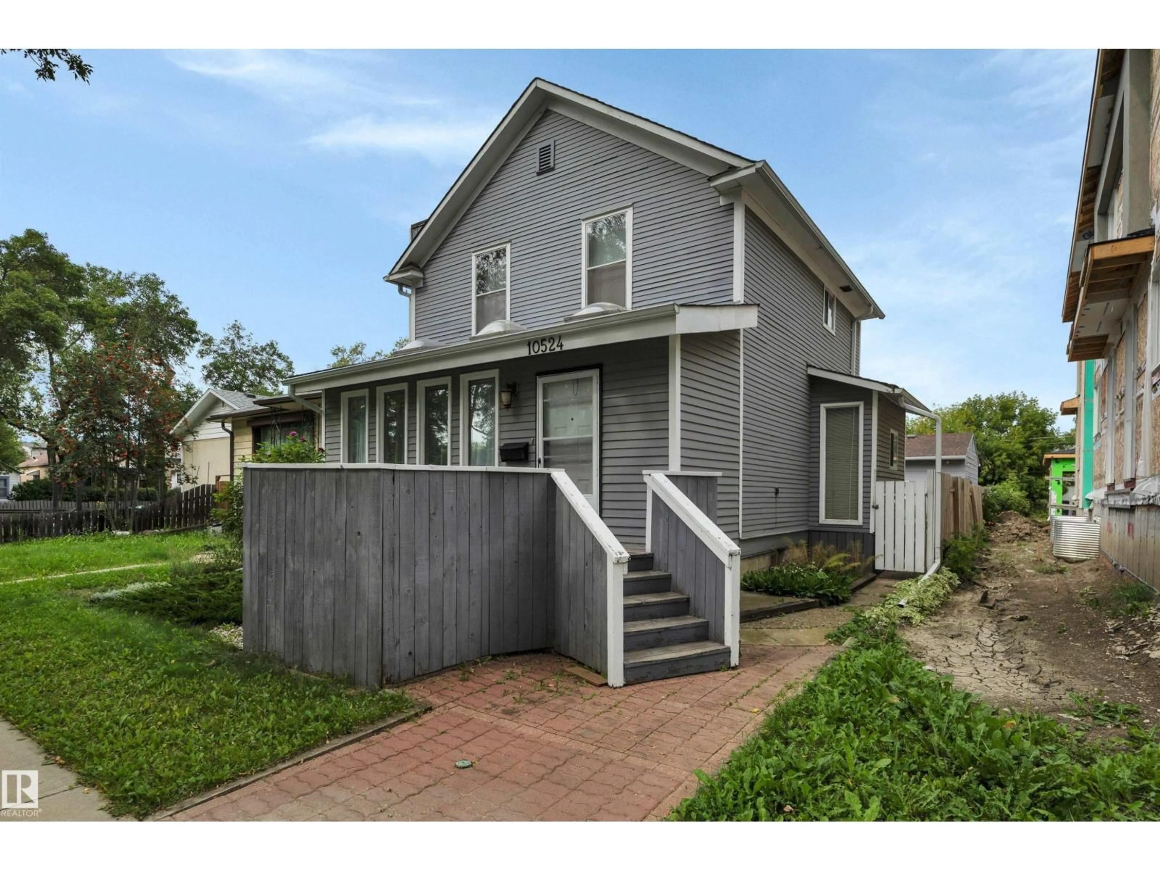 Home with vinyl exterior material, street for 10524 75 AV, Edmonton Alberta T6E1J4