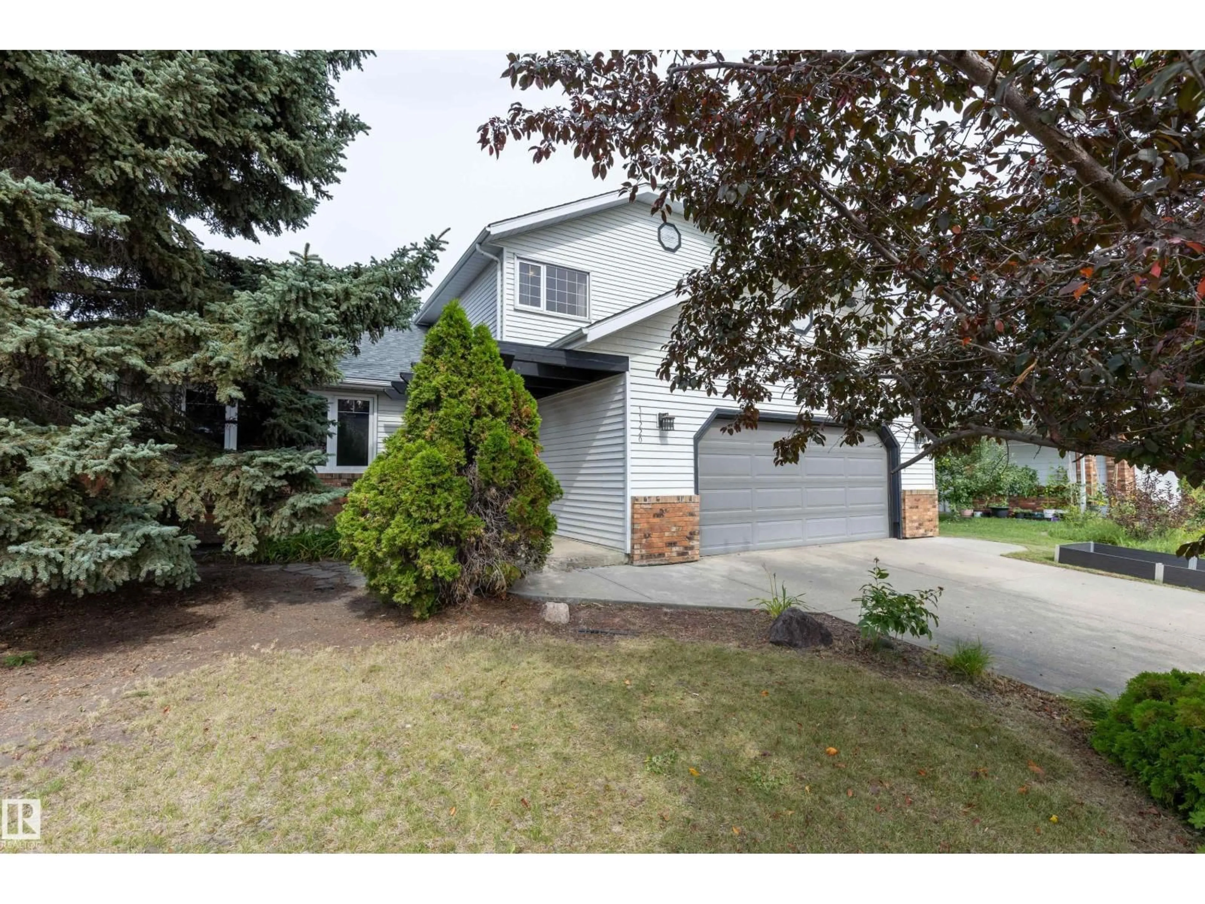 Home with vinyl exterior material, street for NW - 11220 23A AV, Edmonton Alberta T6J4X7