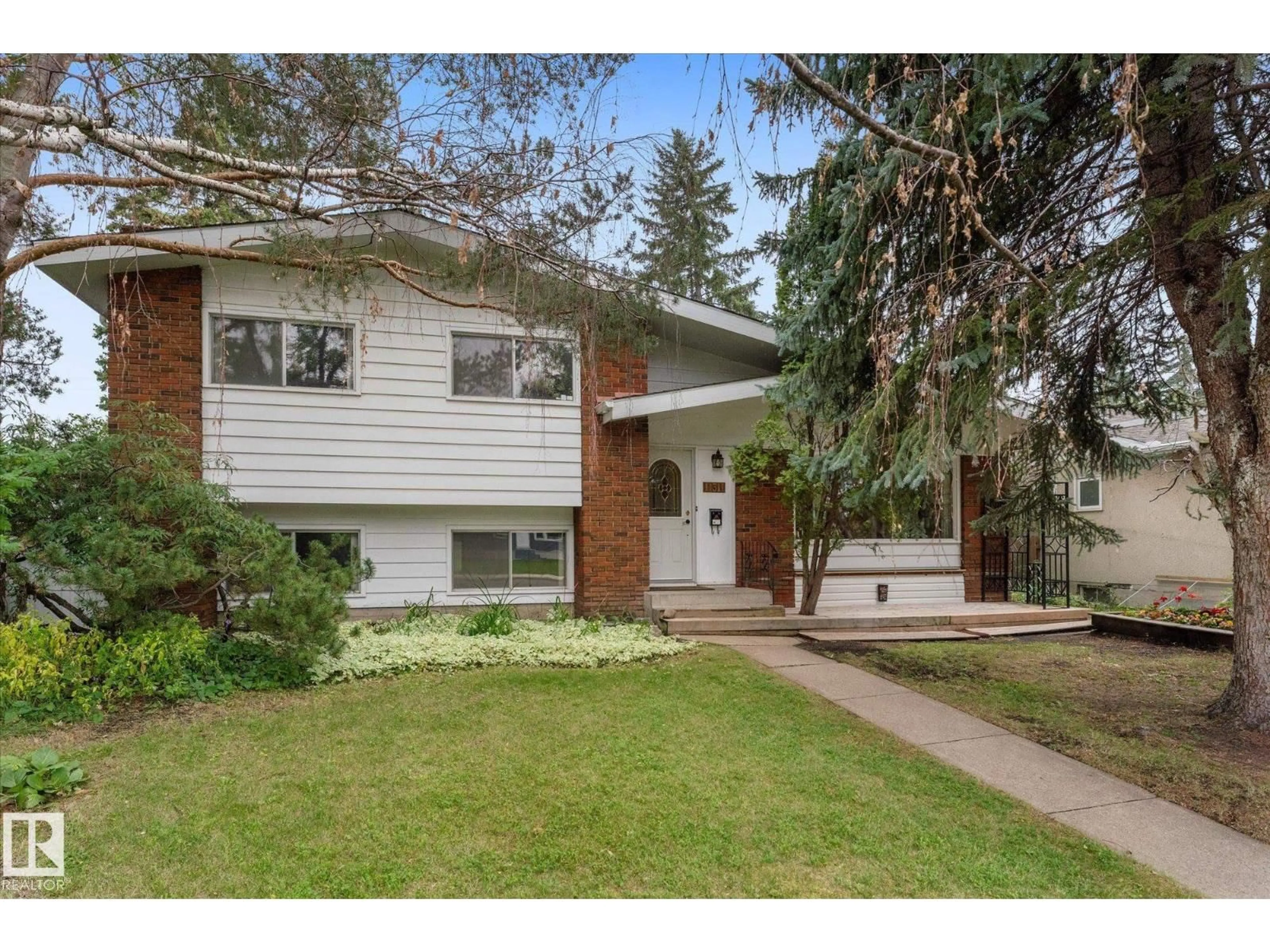 Home with vinyl exterior material, street for 11311 MALMO RD, Edmonton Alberta T6H4M3