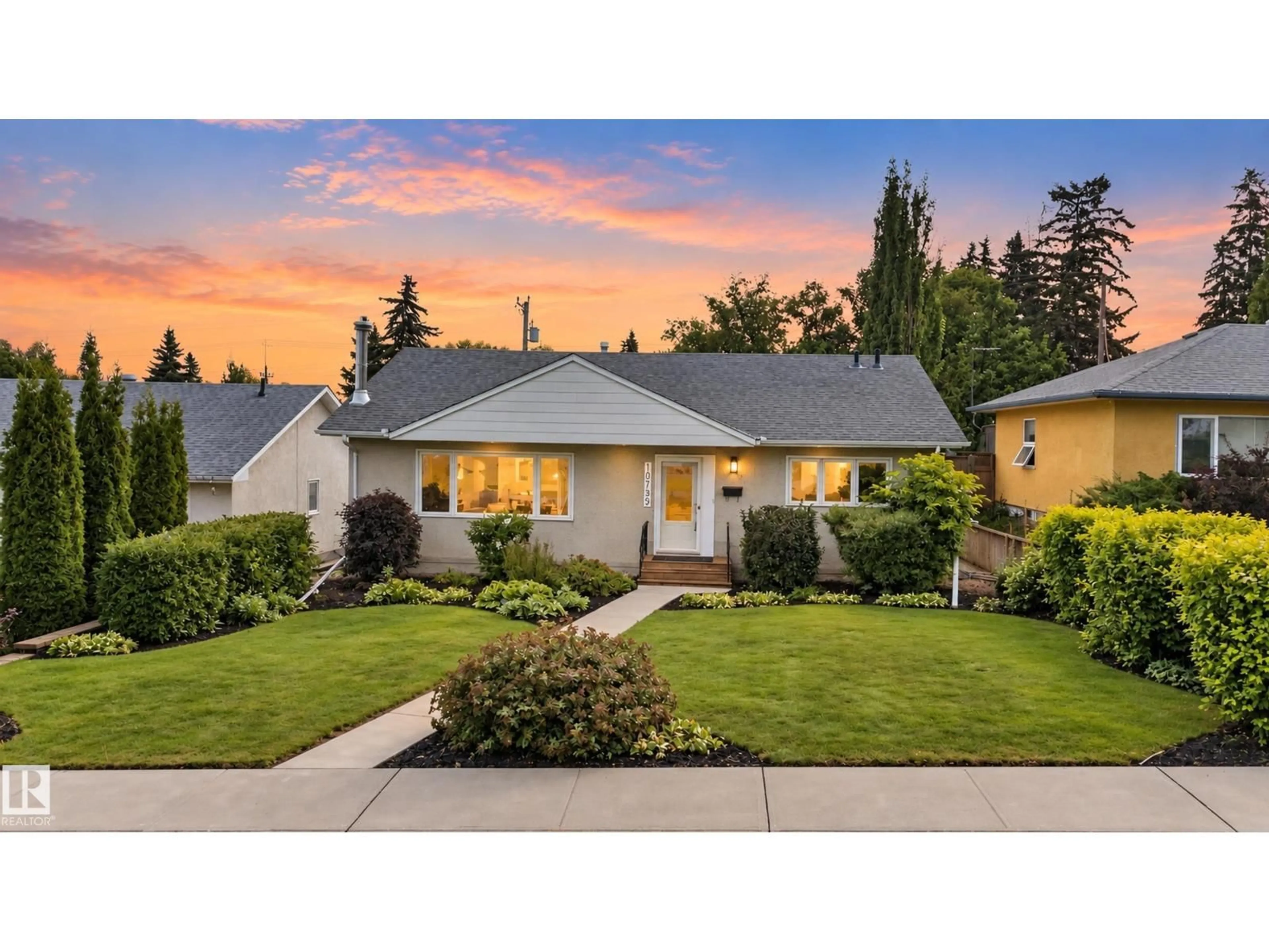 Home with vinyl exterior material, street for NW - 10739 52 ST, Edmonton Alberta T6A2H4