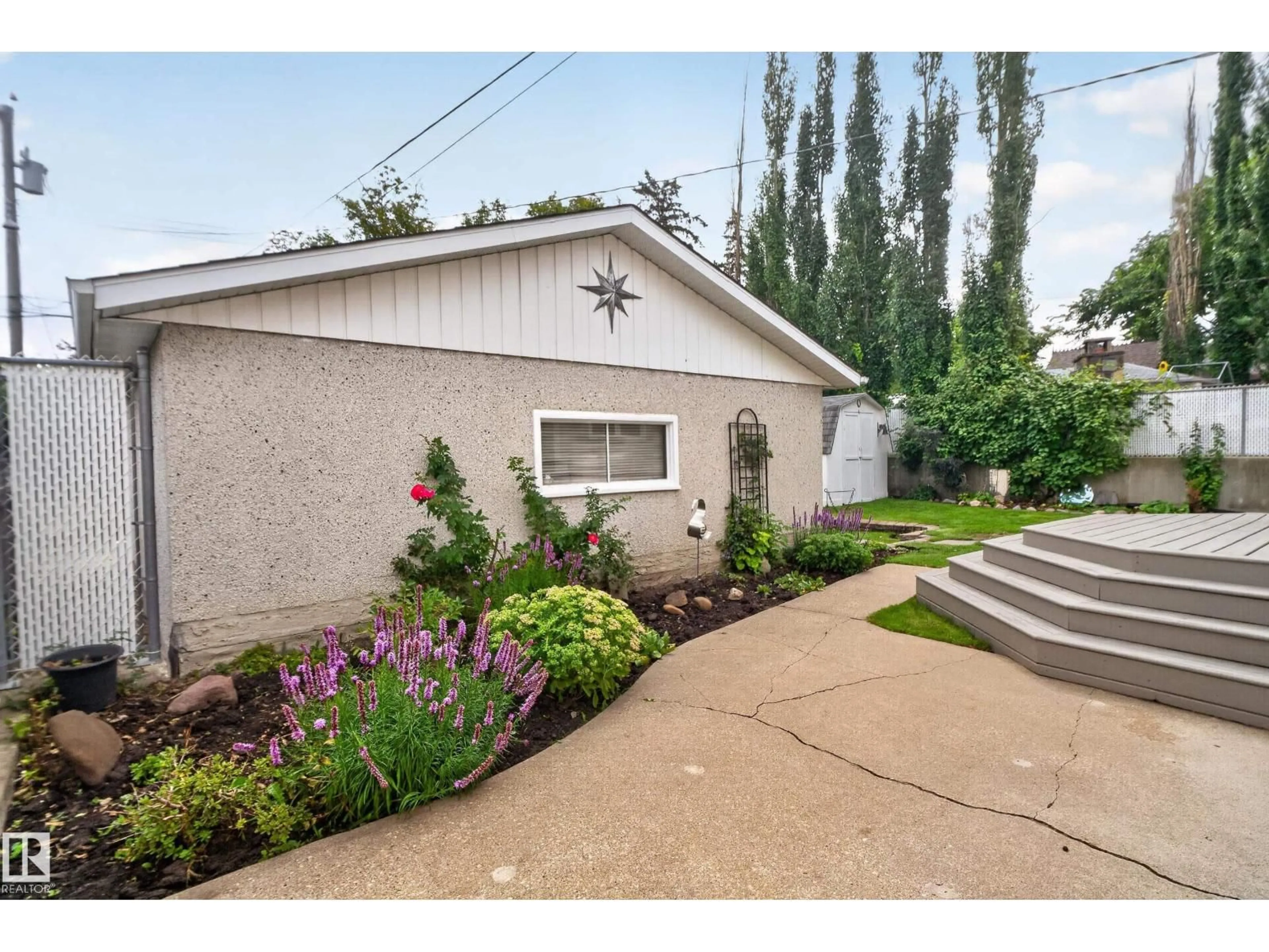 Home with vinyl exterior material, street for NW - 10739 52 ST, Edmonton Alberta T6A2H4