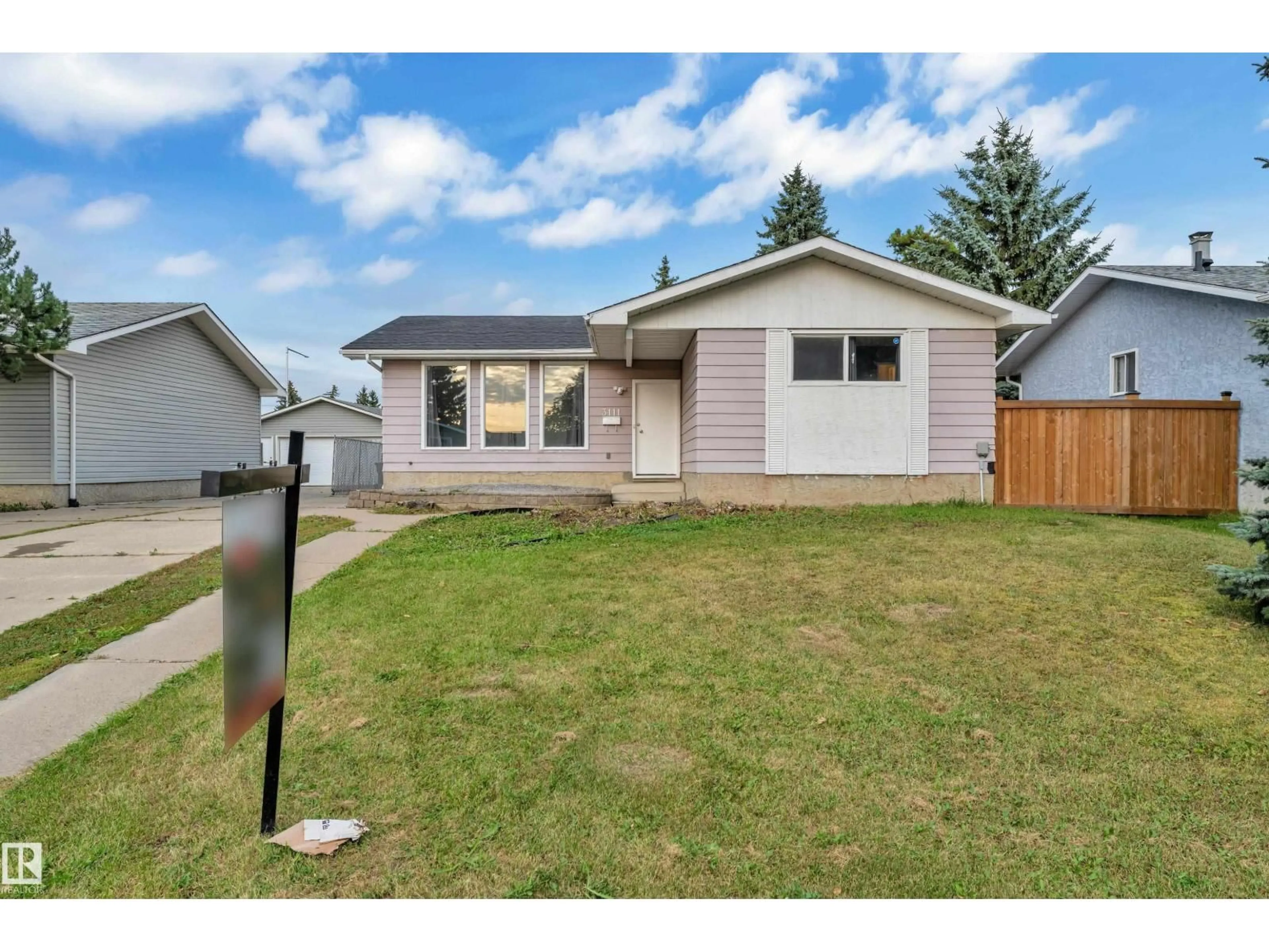 Home with vinyl exterior material, street for 3111 67 ST, Edmonton Alberta T6K1M1