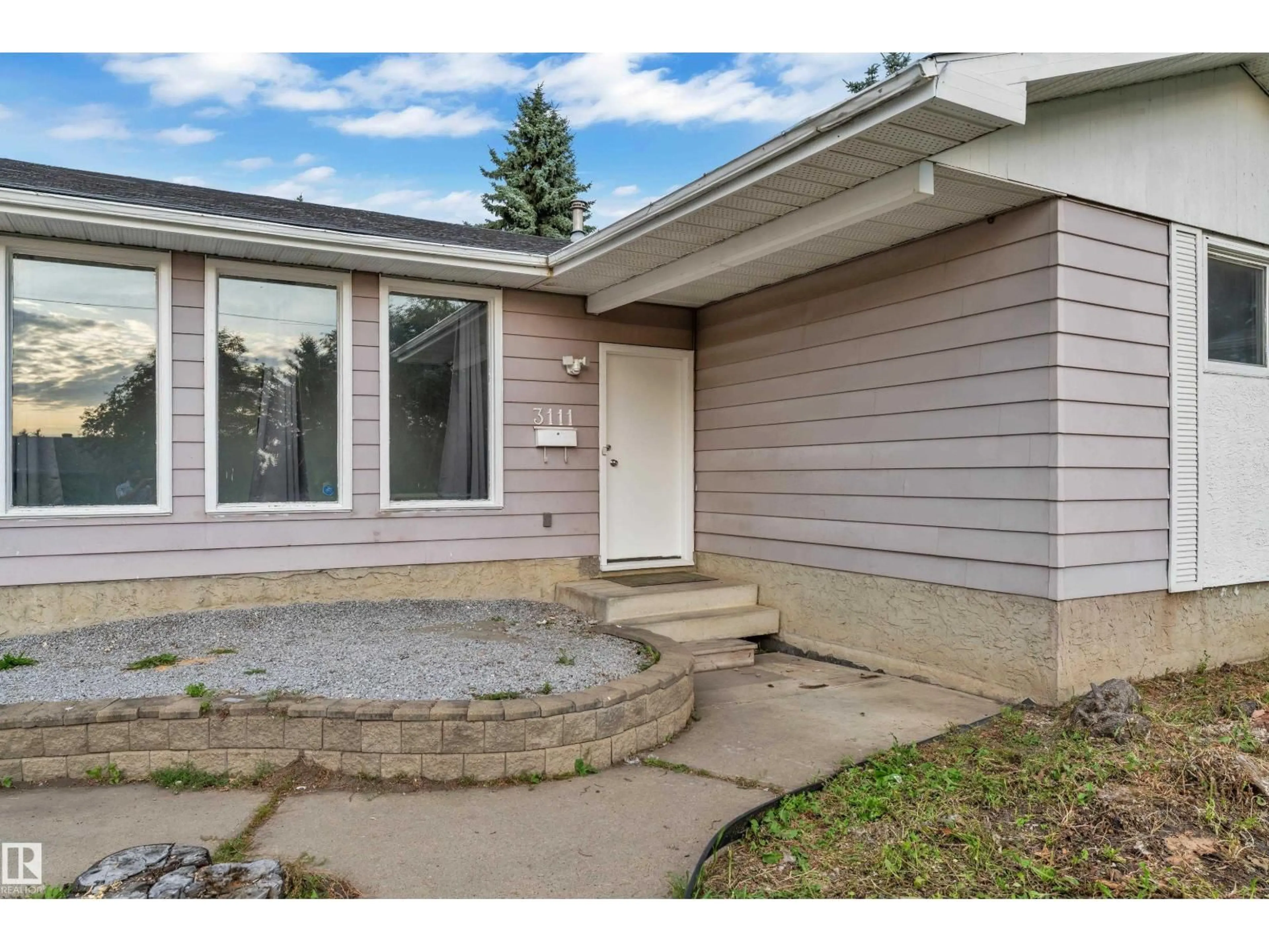 Home with vinyl exterior material, street for 3111 67 ST, Edmonton Alberta T6K1M1