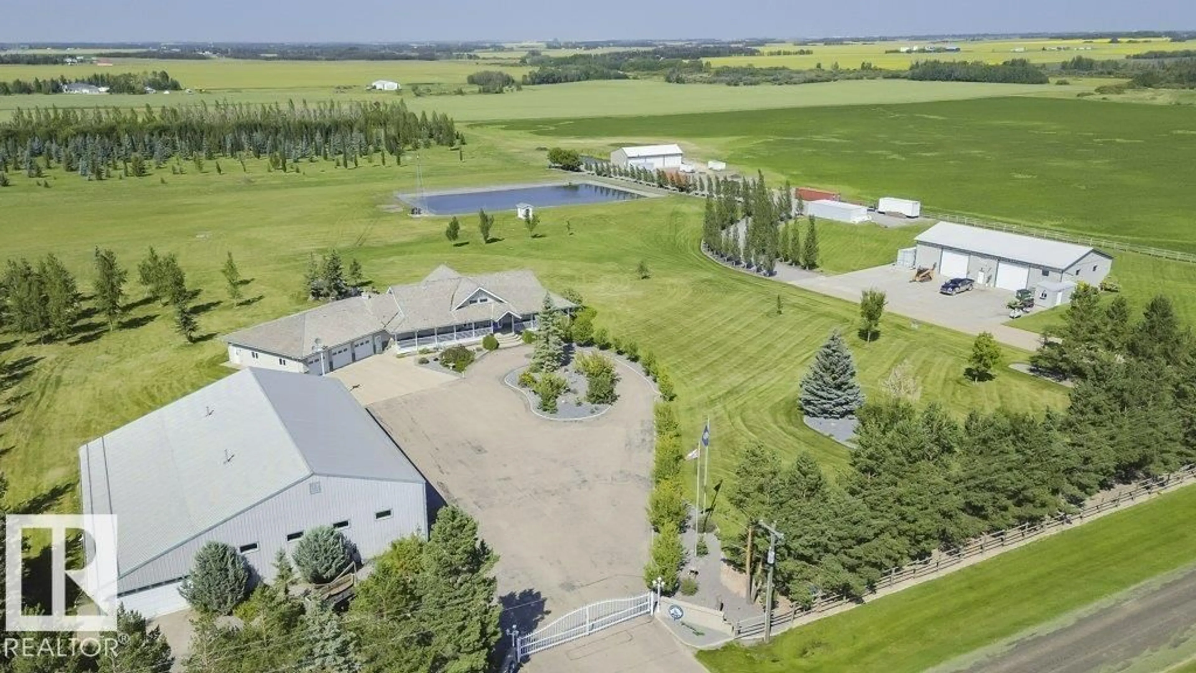 A pic from outside/outdoor area/front of a property/back of a property/a pic from drone, unknown for 25574 TWP RD, Rural Leduc County Alberta T4X2E7