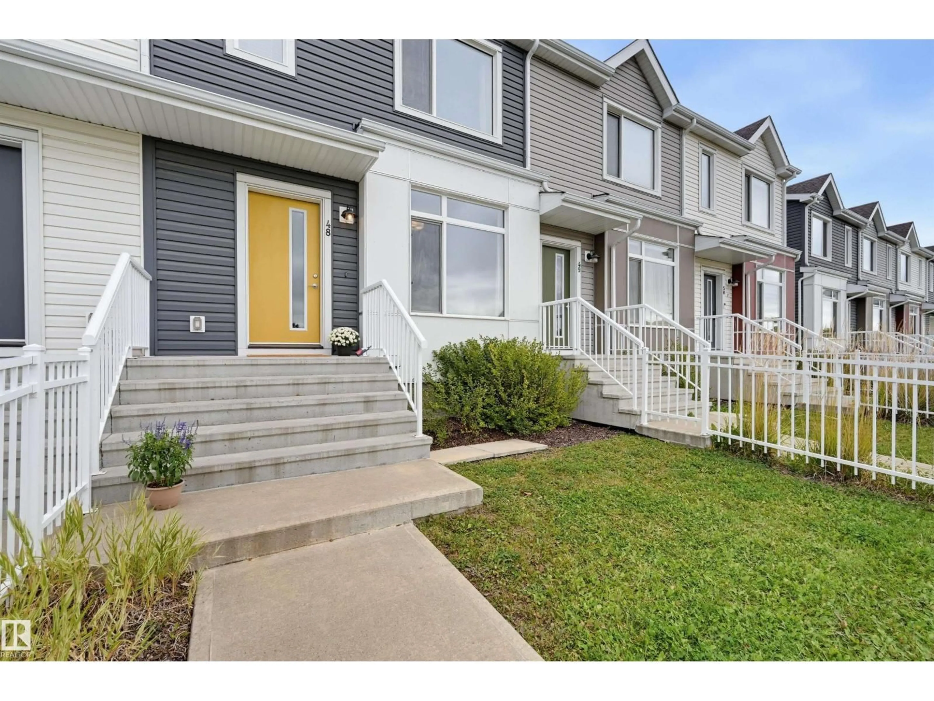 Home with vinyl exterior material, street for 48 215 SADDLEBACK RD, Edmonton Alberta T6J5T6