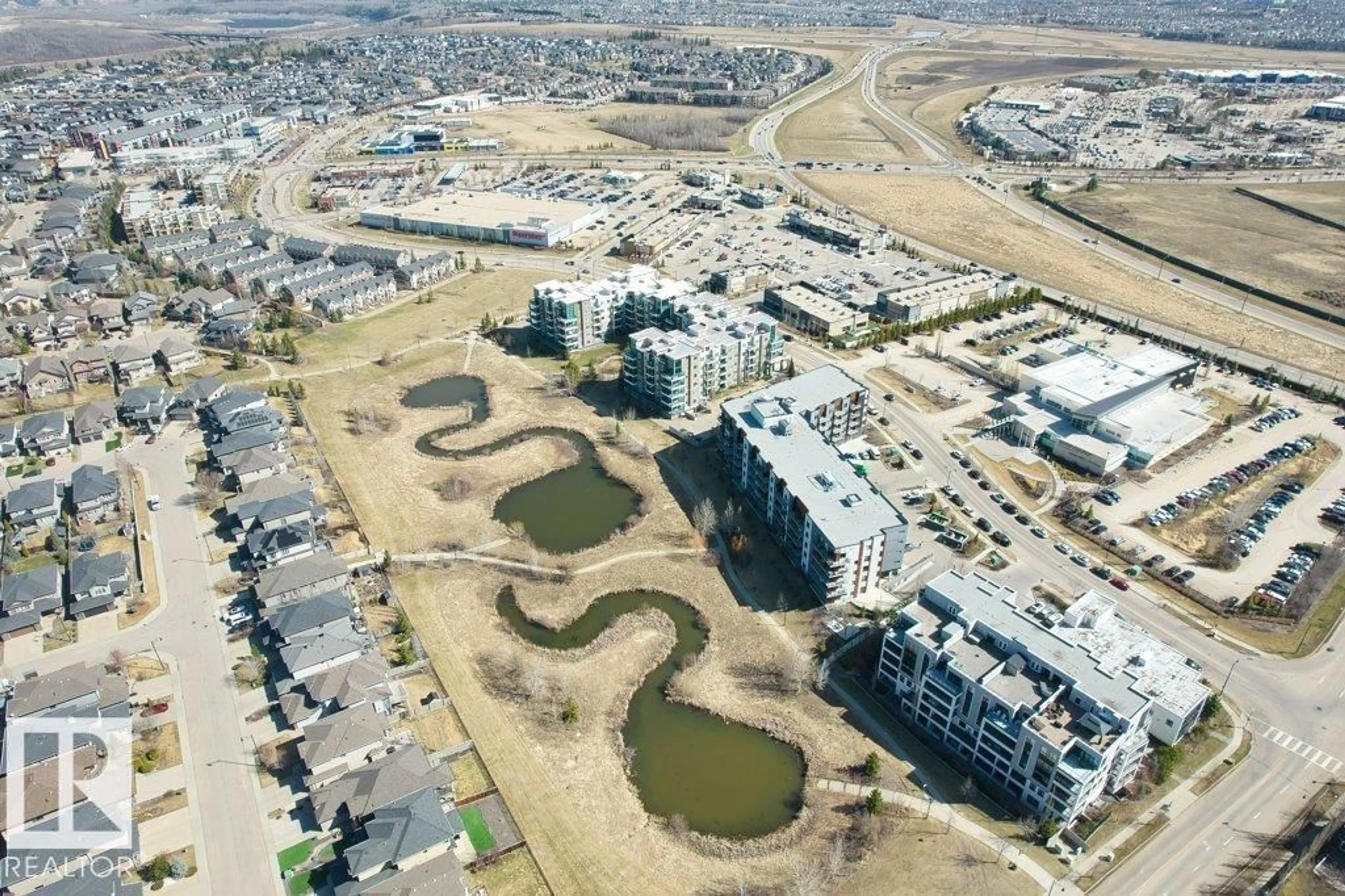 A pic from outside/outdoor area/front of a property/back of a property/a pic from drone, unknown for 1316 WINDERMERE WY, Edmonton Alberta T6W2J3
