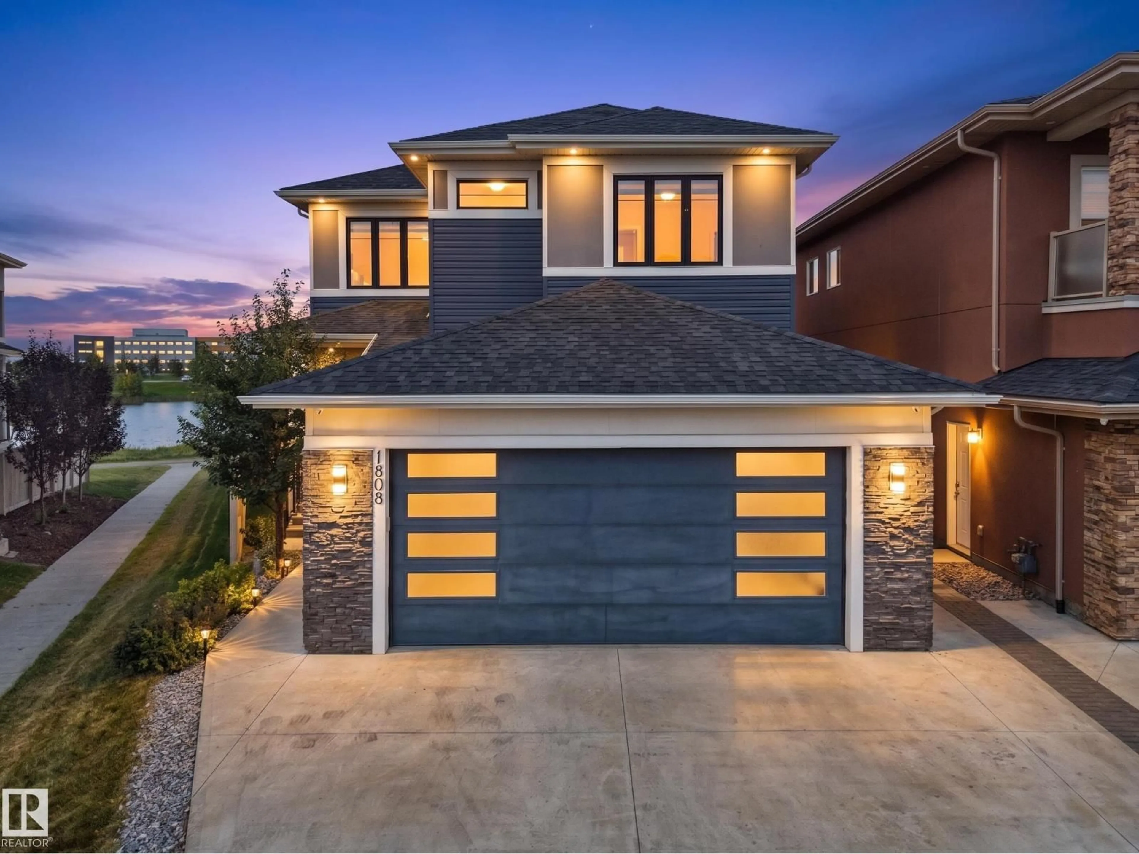Home with brick exterior material, street for NW - 1808 20 AV, Edmonton Alberta T6T2K9
