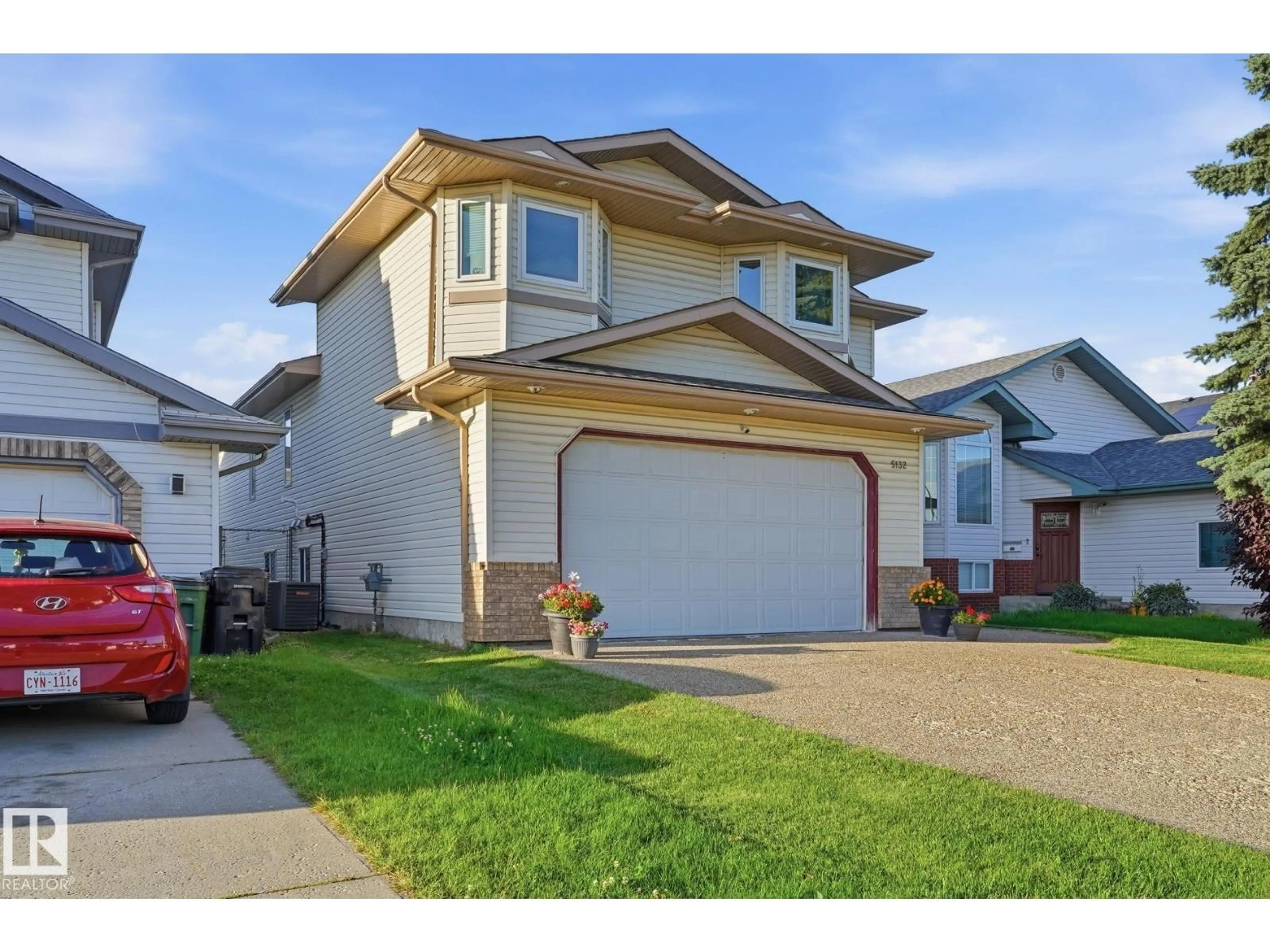 Home with vinyl exterior material, street for 5132 157 AV, Edmonton Alberta T5Y2X5