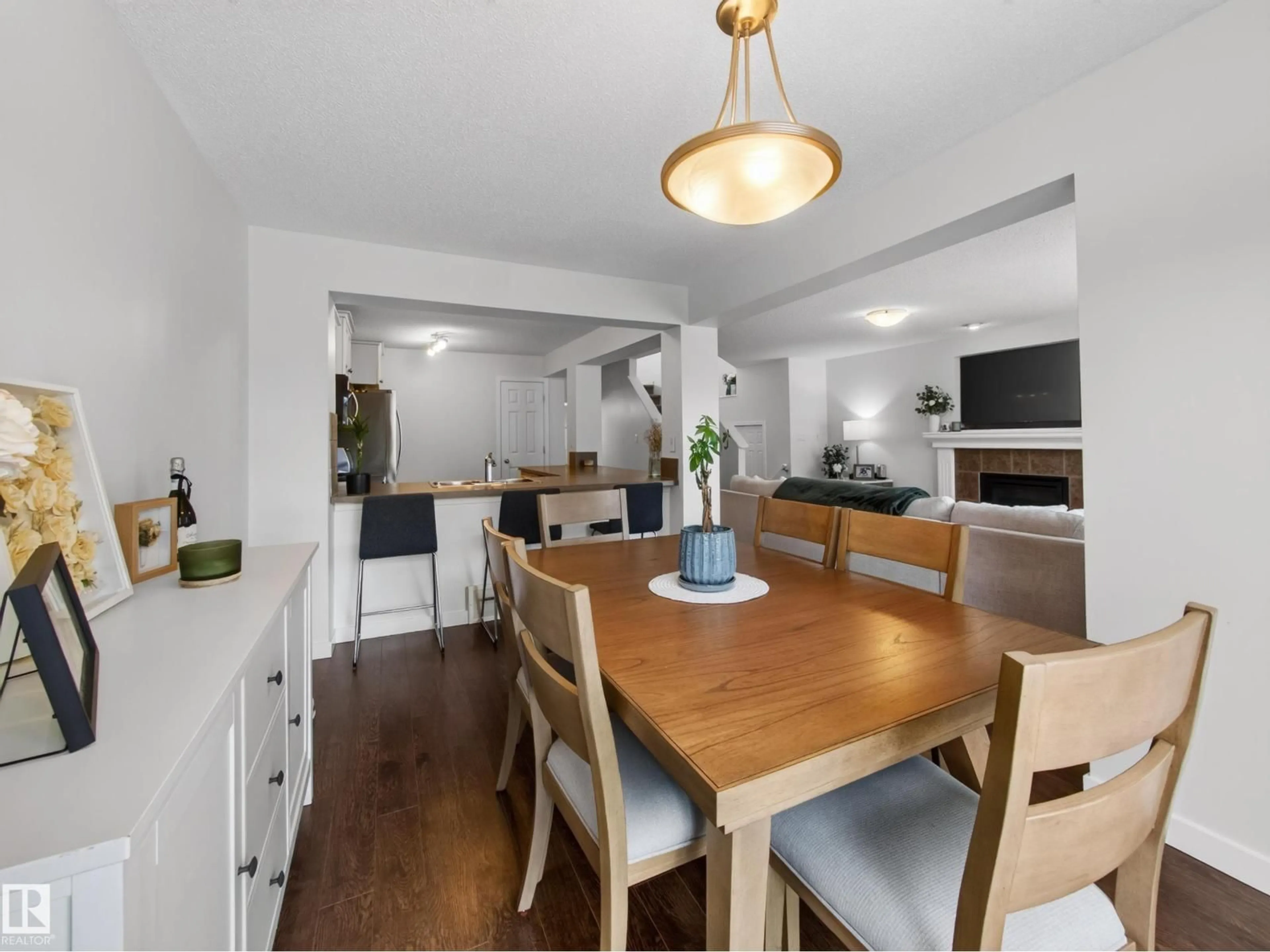Open concept kitchen, wood/laminate floor for 64 CAMPBELL COURT, Fort Saskatchewan Alberta T8L0E5