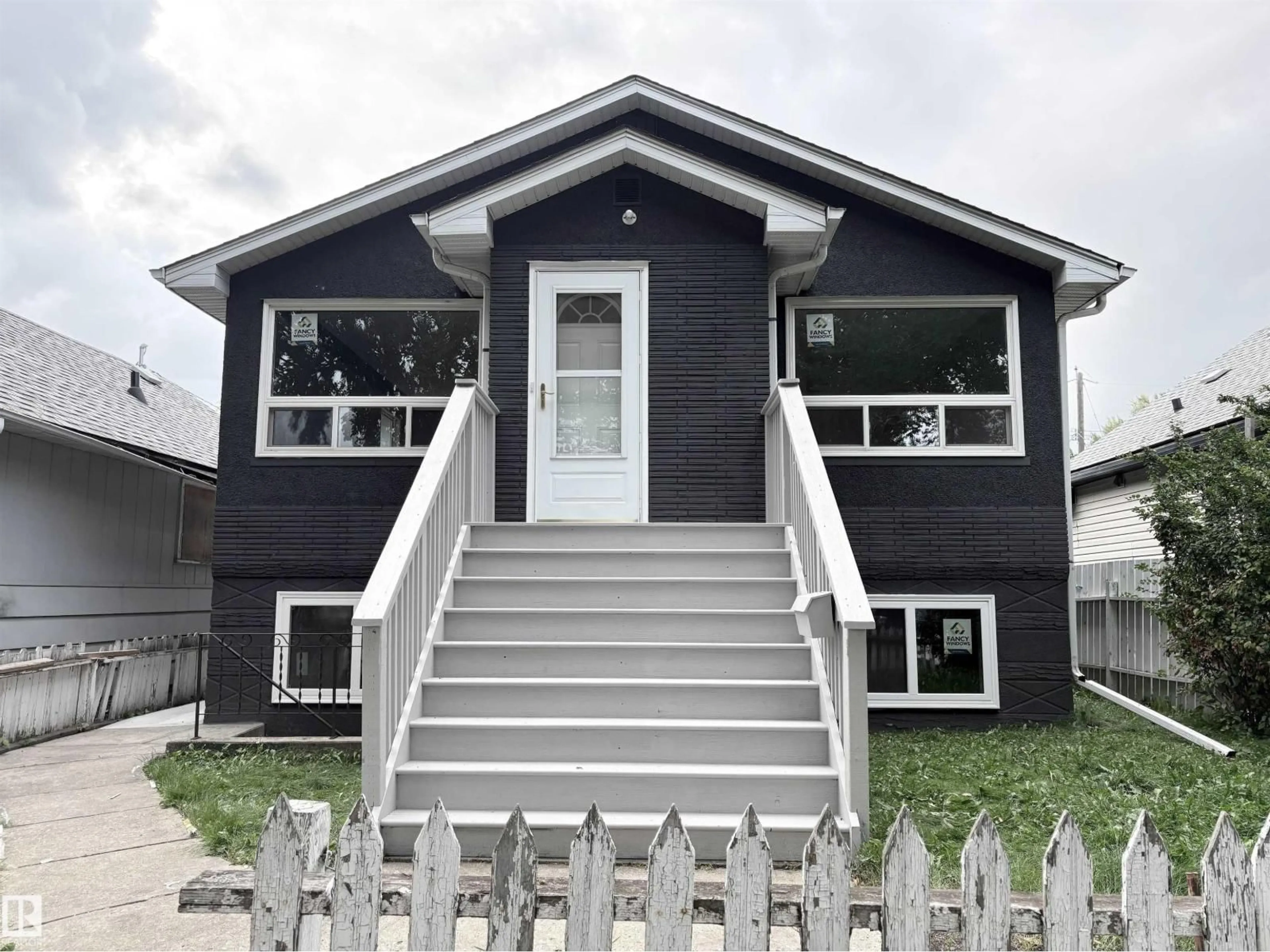 Home with vinyl exterior material, street for NW - 12764 118 ST, Edmonton Alberta T5E5K8