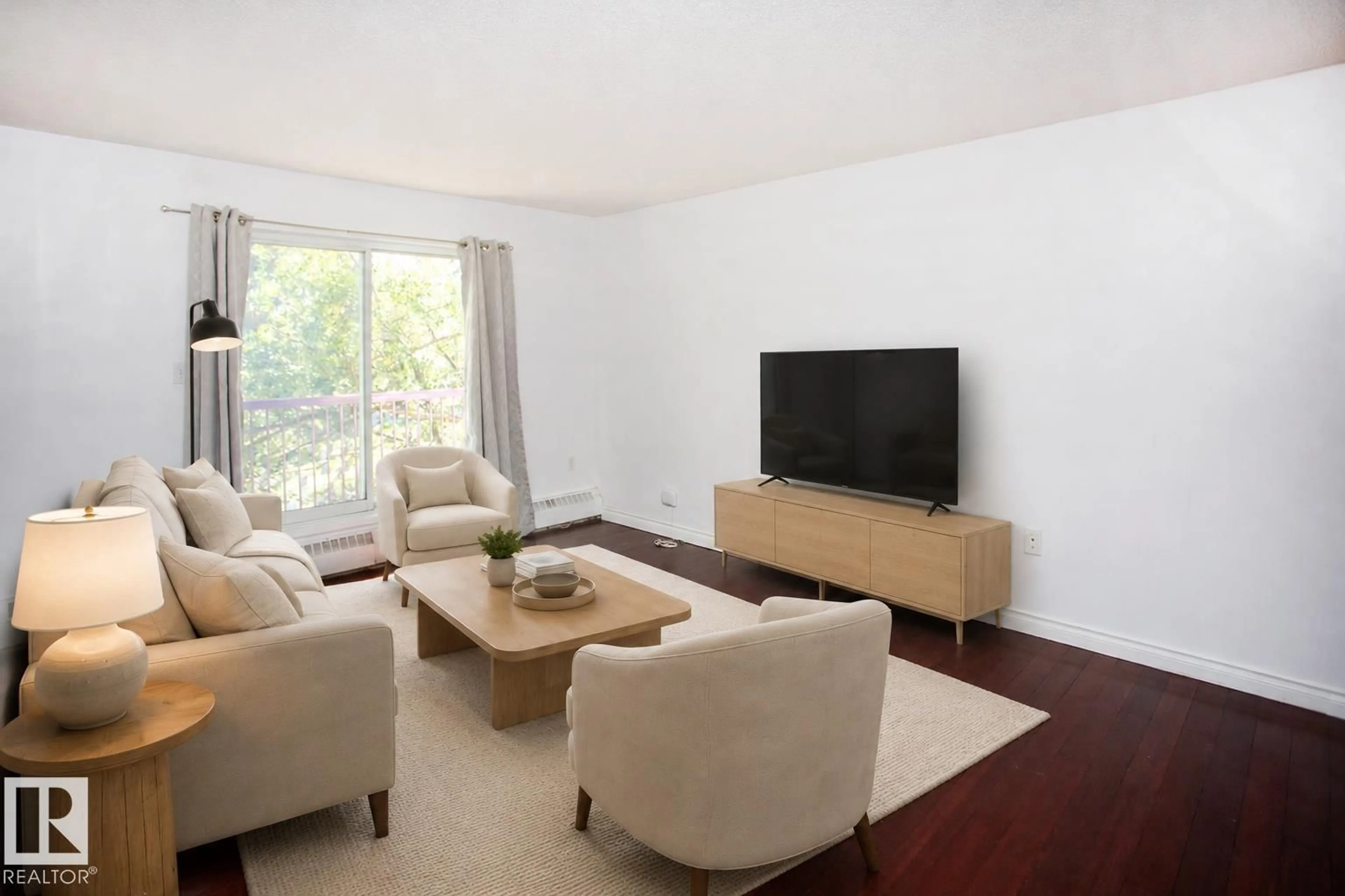 Living room with furniture, wood/laminate floor for #309 - 10636 120 ST, Edmonton Alberta T5H4L5