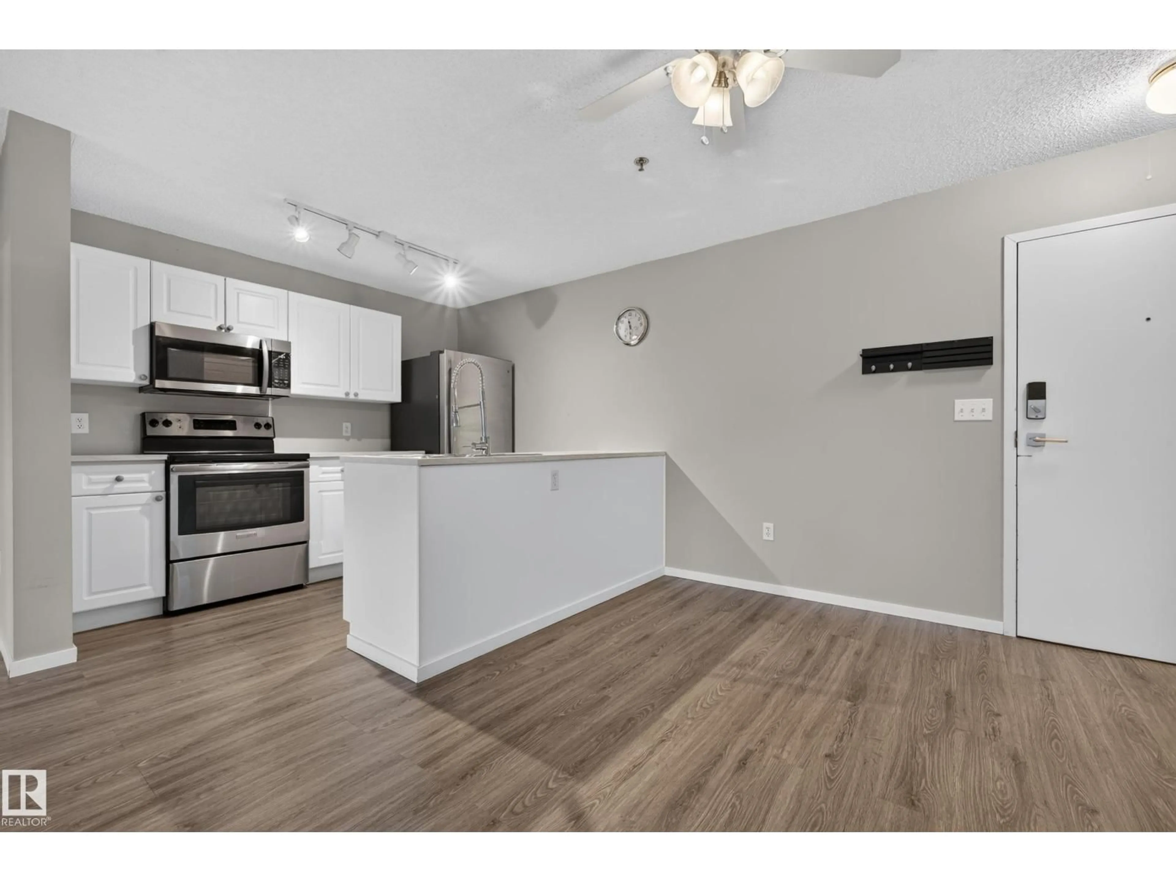 Open concept kitchen, wood/laminate floor for 23 10331 106 ST NW, Edmonton Alberta T5J1H8