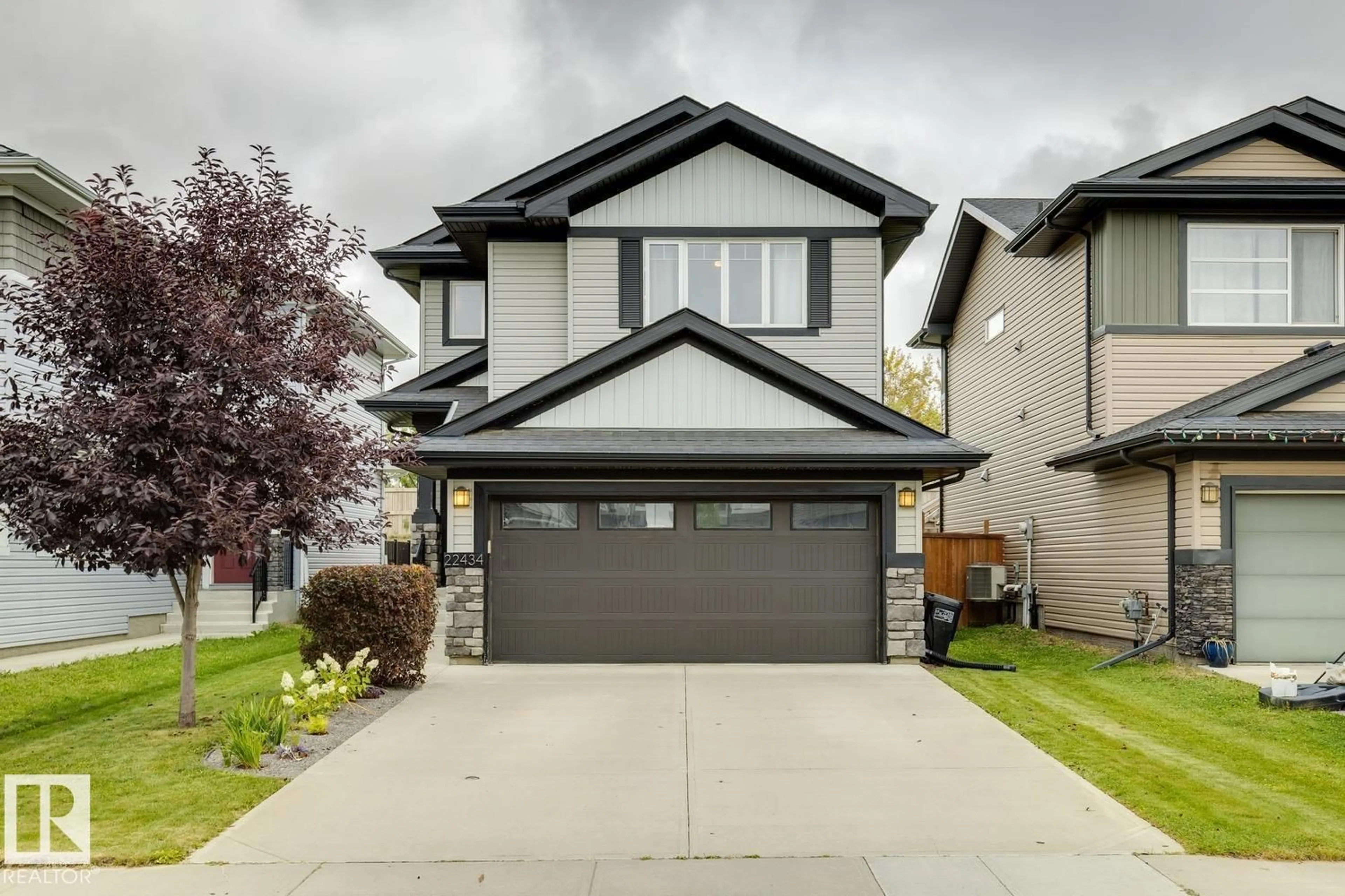 Home with vinyl exterior material, street for 22434 99A AV, Edmonton Alberta T5T7C3