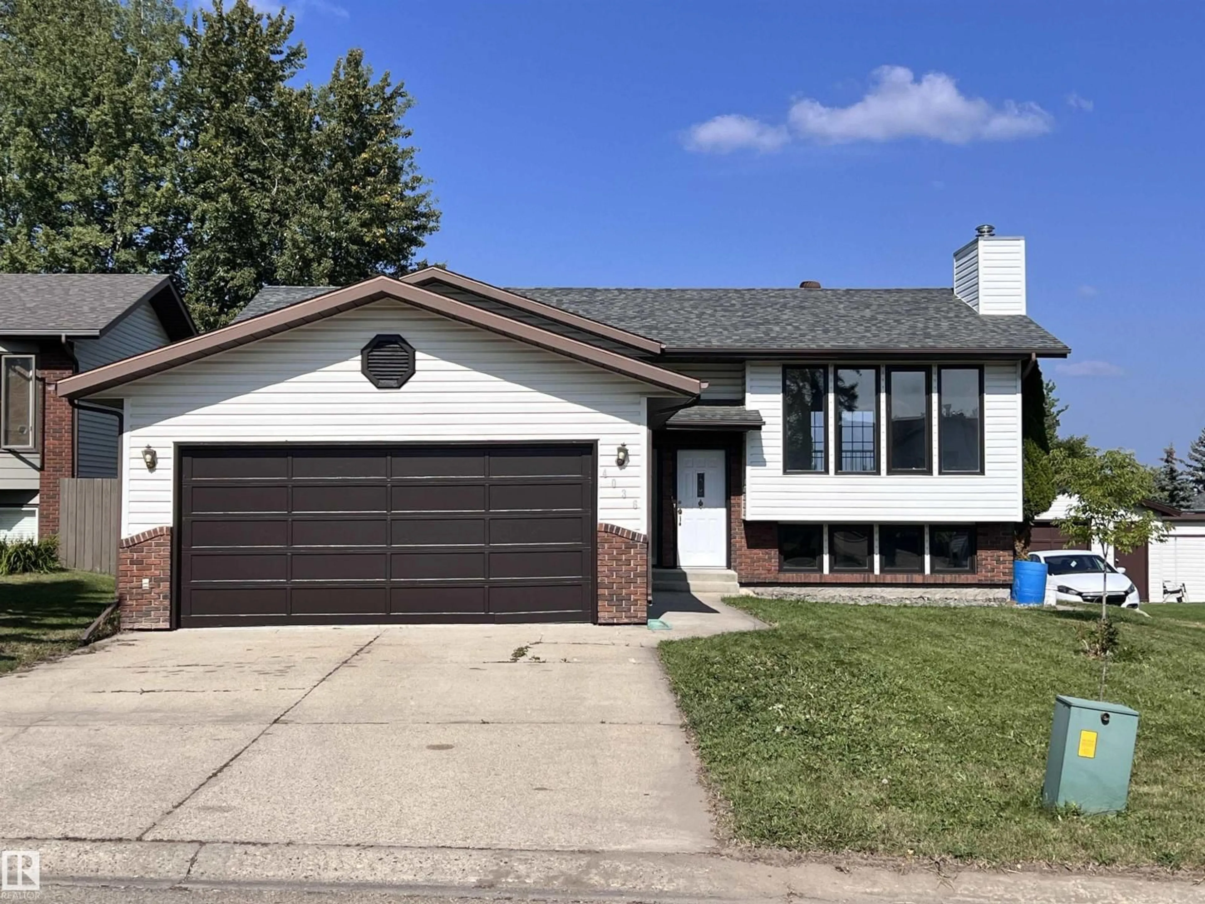 Home with vinyl exterior material, street for 4036 55 AVENUE, Drayton Valley Alberta T7A1B2