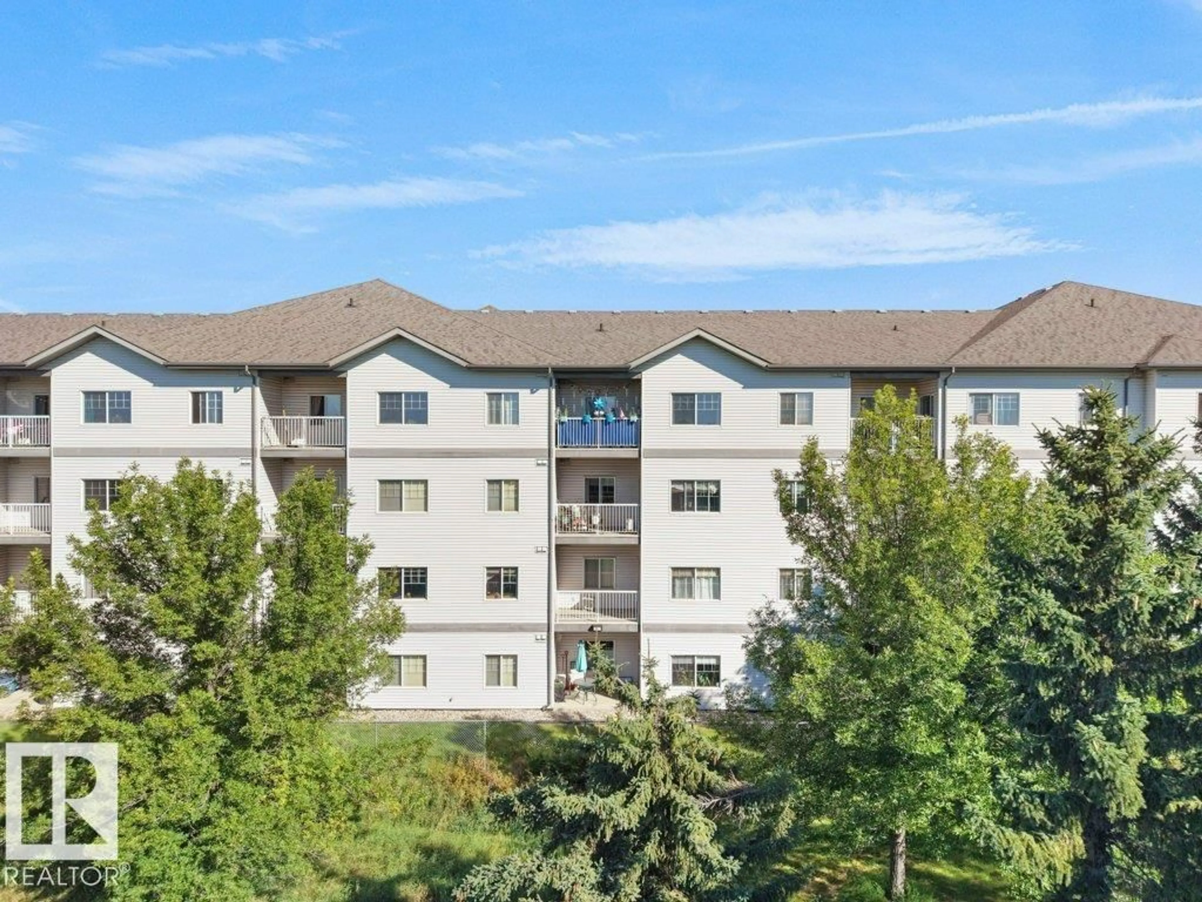 A pic from outside/outdoor area/front of a property/back of a property/a pic from drone, mountain view for #116 - 16807 100 AV, Edmonton Alberta T5P4Z6