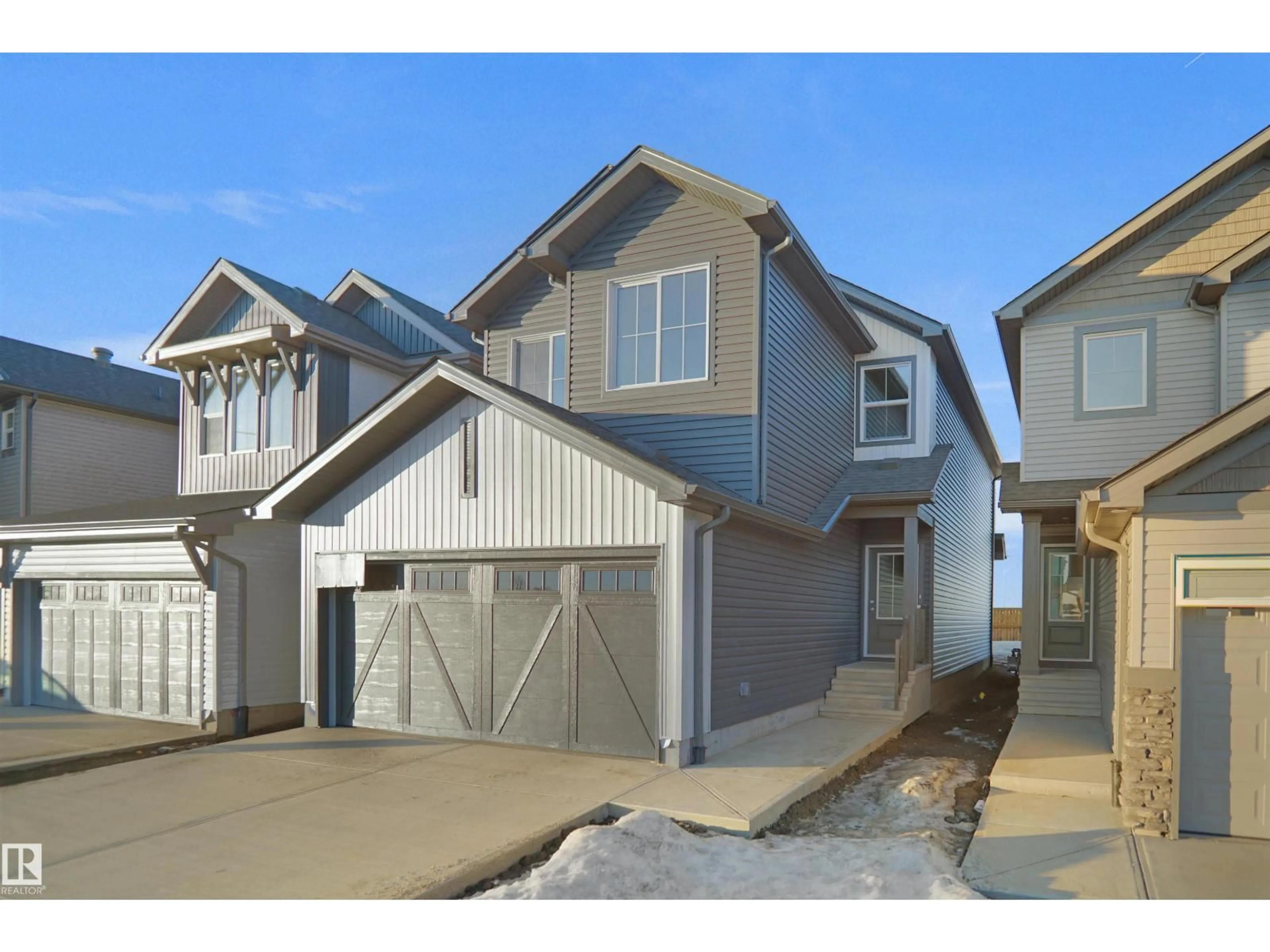 Home with vinyl exterior material, street for 20932 16 AV, Edmonton Alberta T6M3J4