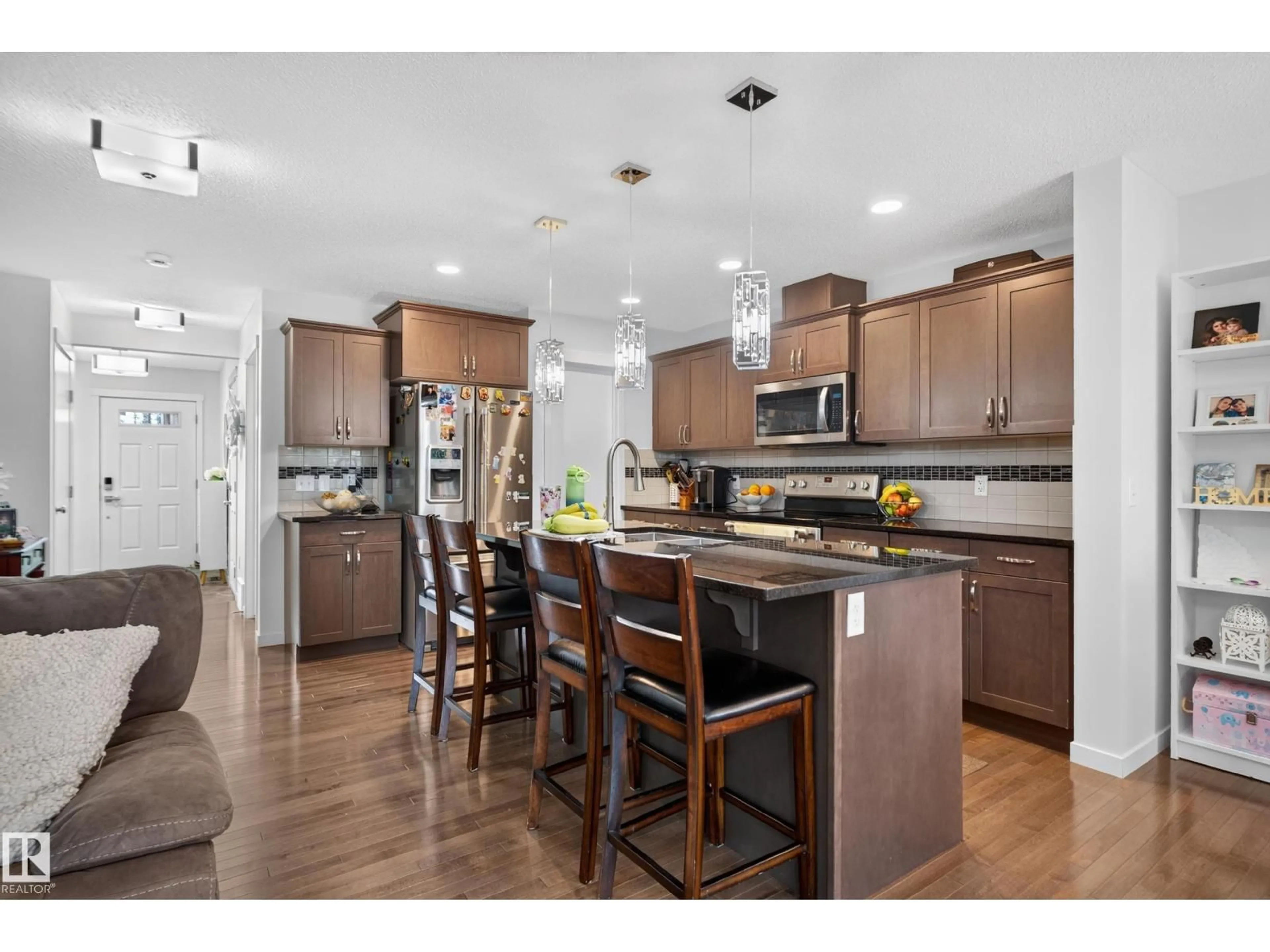 Open concept kitchen, wood/laminate floor for 17363 120 ST, Edmonton Alberta T5X0K5
