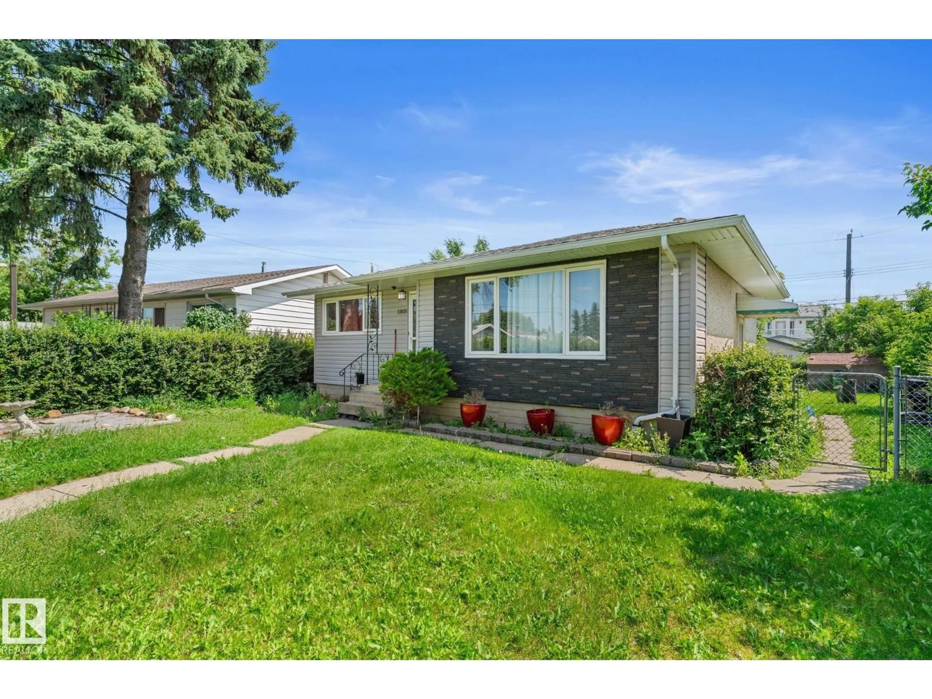 Home with vinyl exterior material, street for 13131 60 STREET, Edmonton Alberta T5A0S2
