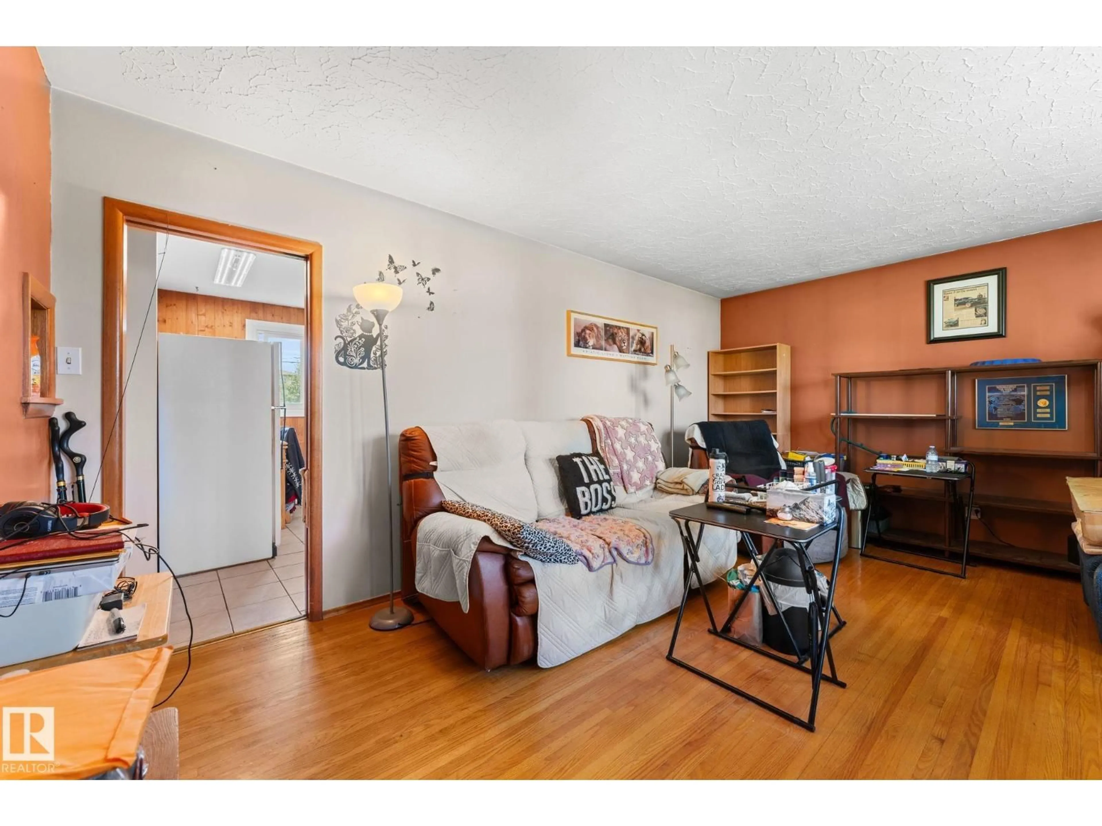 Living room with furniture, wood/laminate floor for 13131 60 STREET, Edmonton Alberta T5A0S2