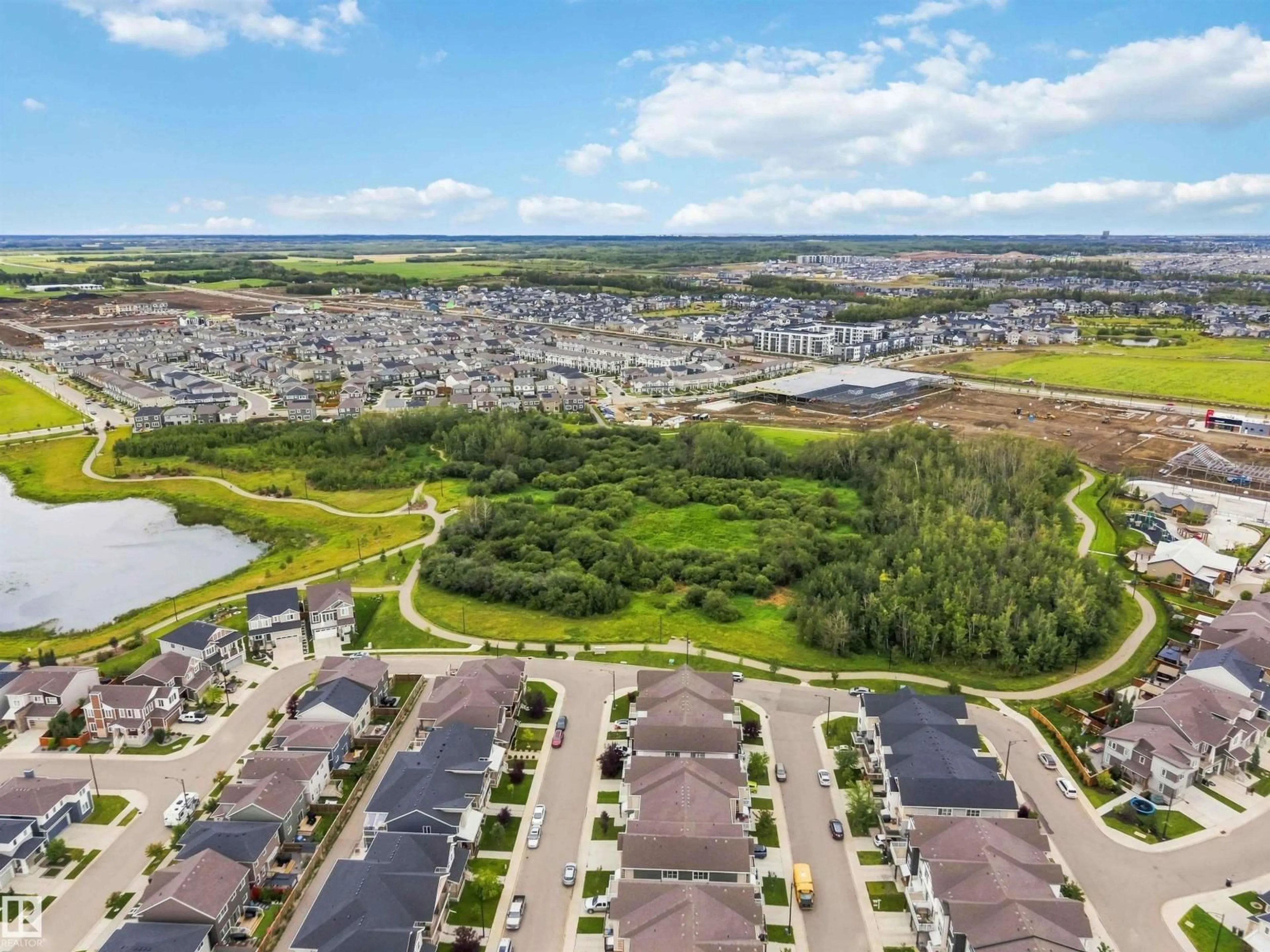 A pic from outside/outdoor area/front of a property/back of a property/a pic from drone, water/lake/river/ocean view for NW - 20127 19 AV, Edmonton Alberta T6M0X9