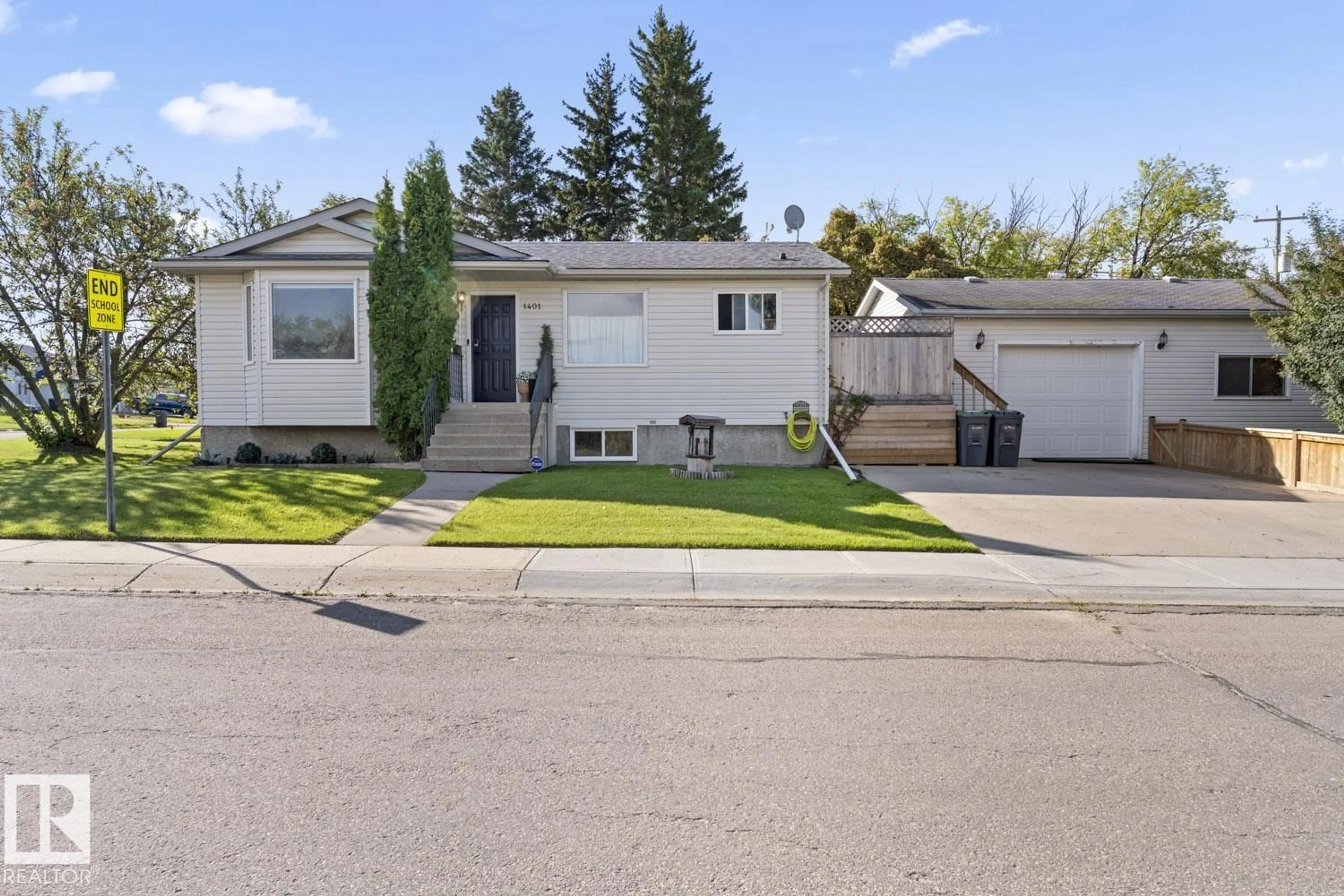 Home with vinyl exterior material, street for 1401 9 ST, Cold Lake Alberta T9M1J7