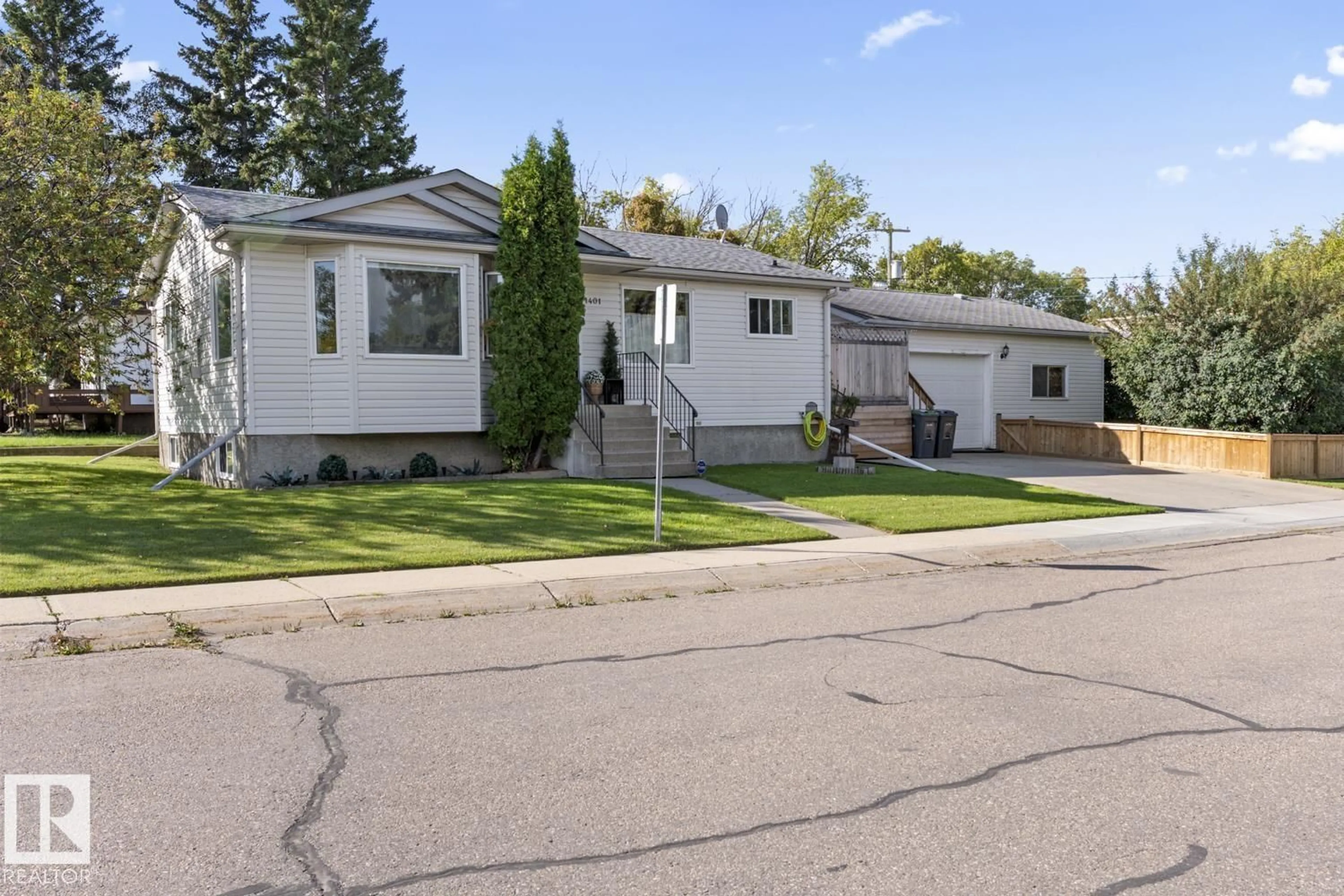 Home with vinyl exterior material, street for 1401 9 ST, Cold Lake Alberta T9M1J7