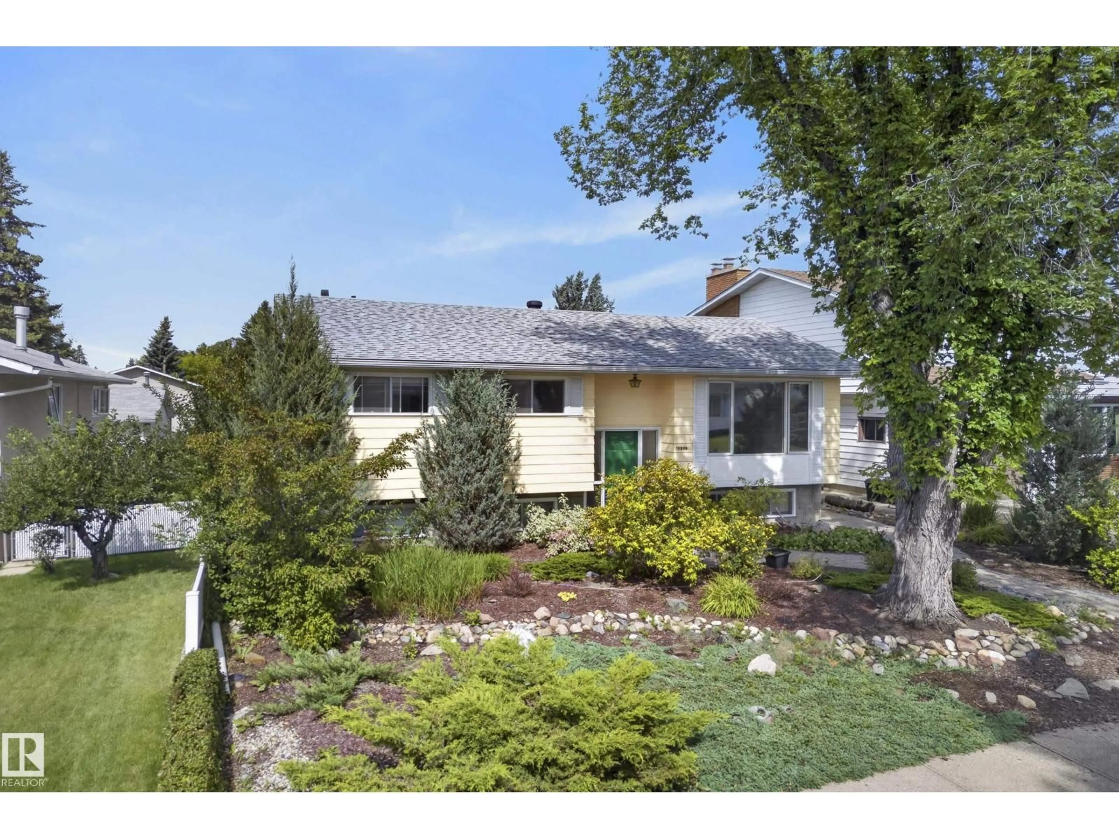 Home with vinyl exterior material, street for NW - 10968 35A AV, Edmonton Alberta T6J0A3
