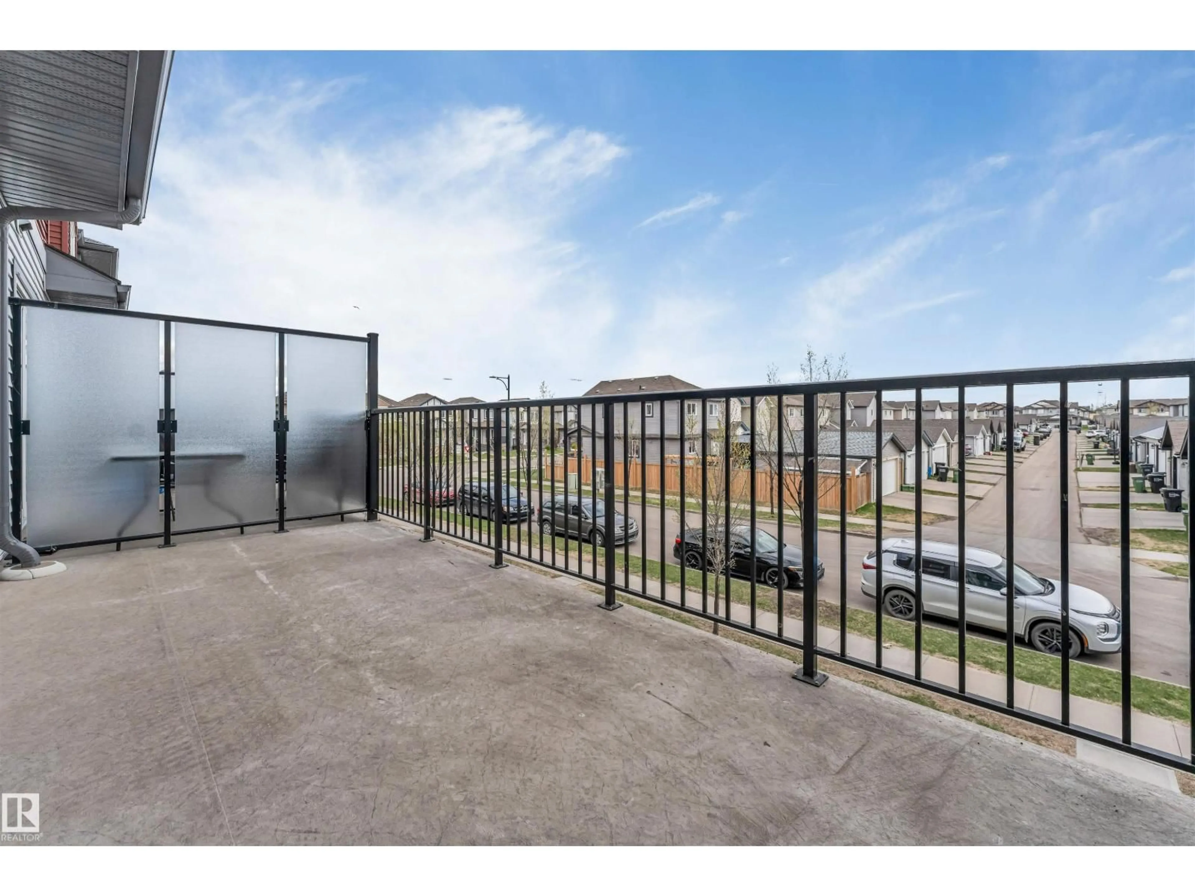 Patio, city buildings view from balcony for 3340 15A AV, Edmonton Alberta T6T0Y1