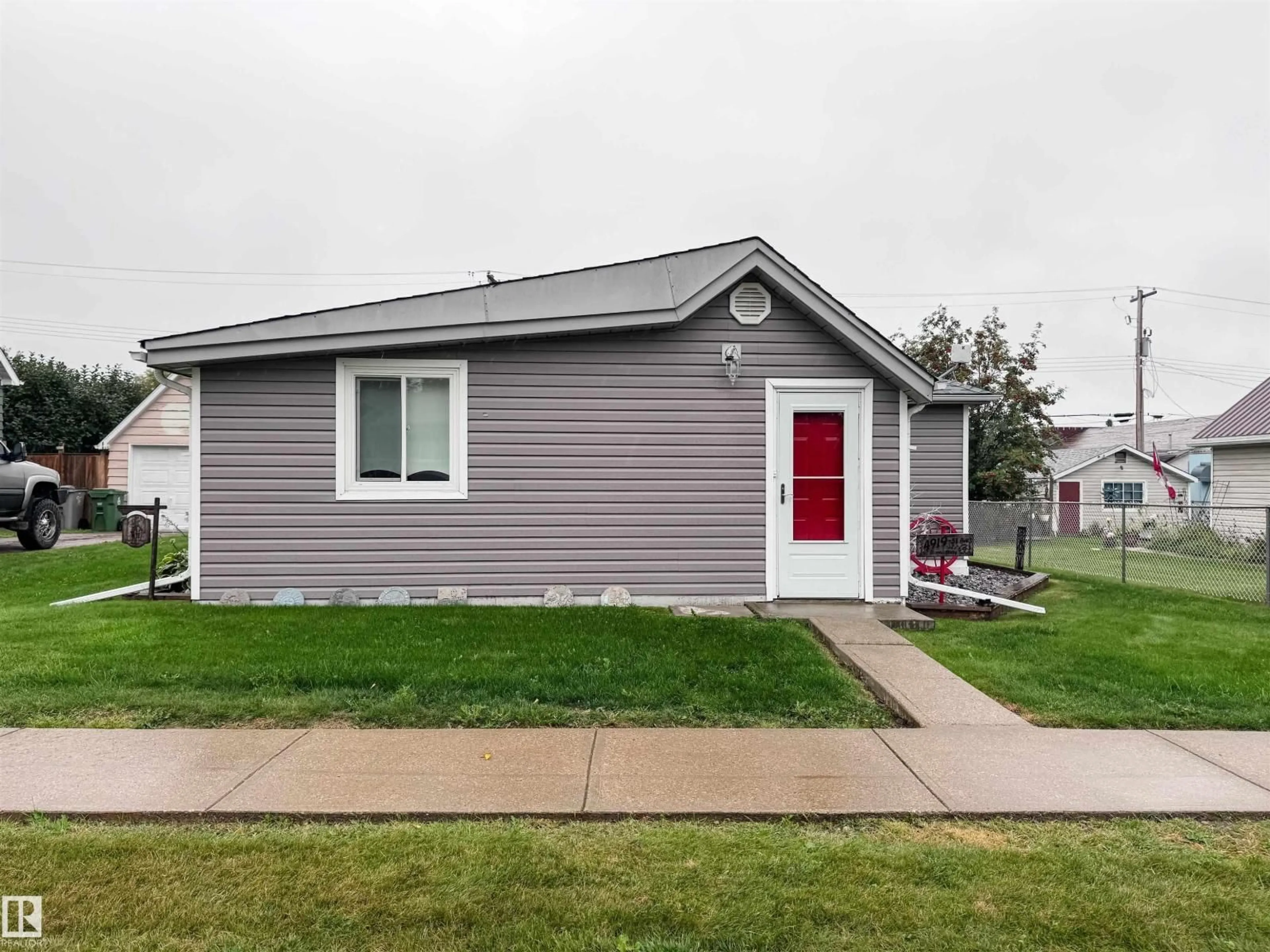 Home with vinyl exterior material, street for 4919 51 AV, Breton Alberta T0C0P0