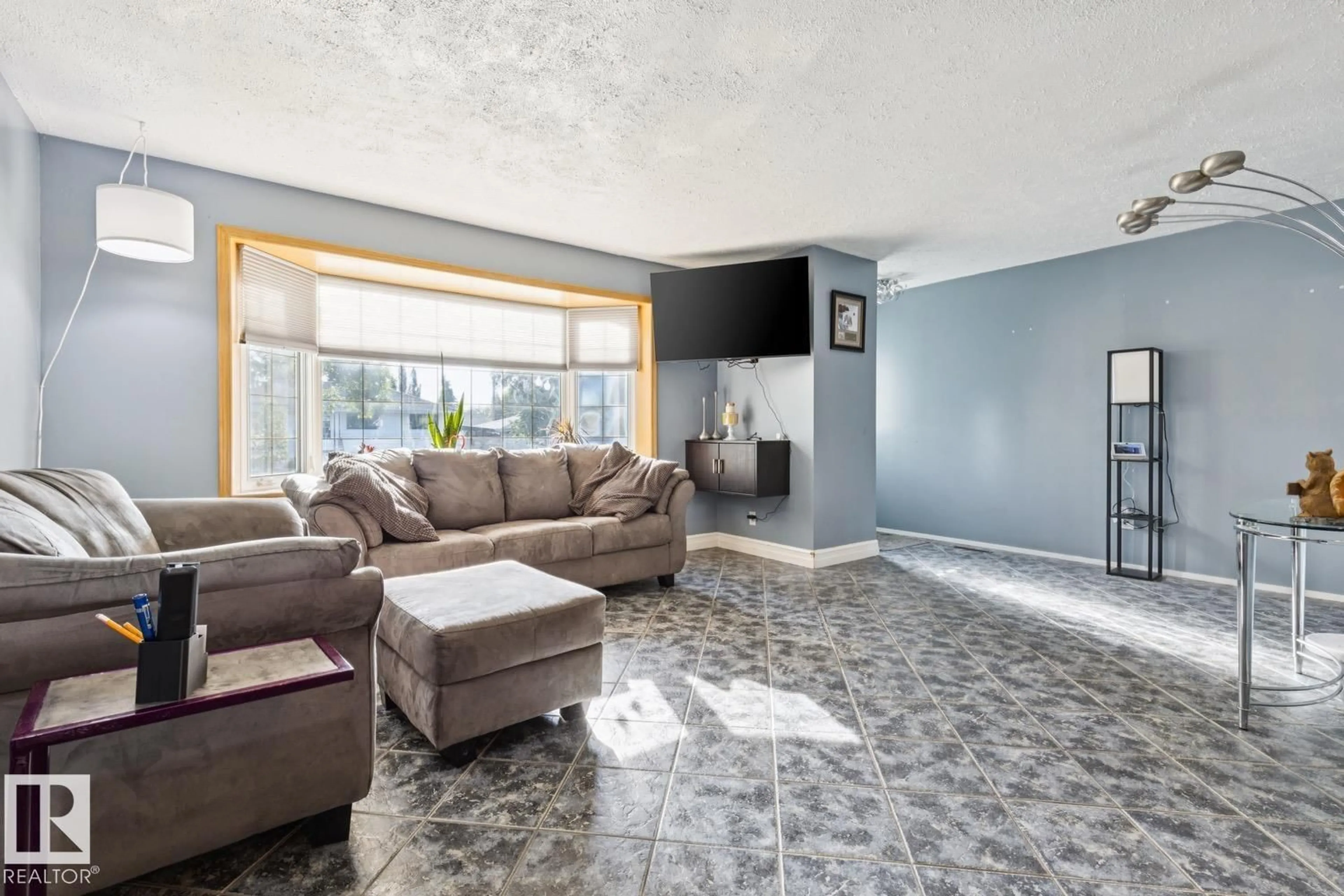 Living room with furniture, ceramic/tile floor for NW - 10830 159 ST, Edmonton Alberta T5P3B7