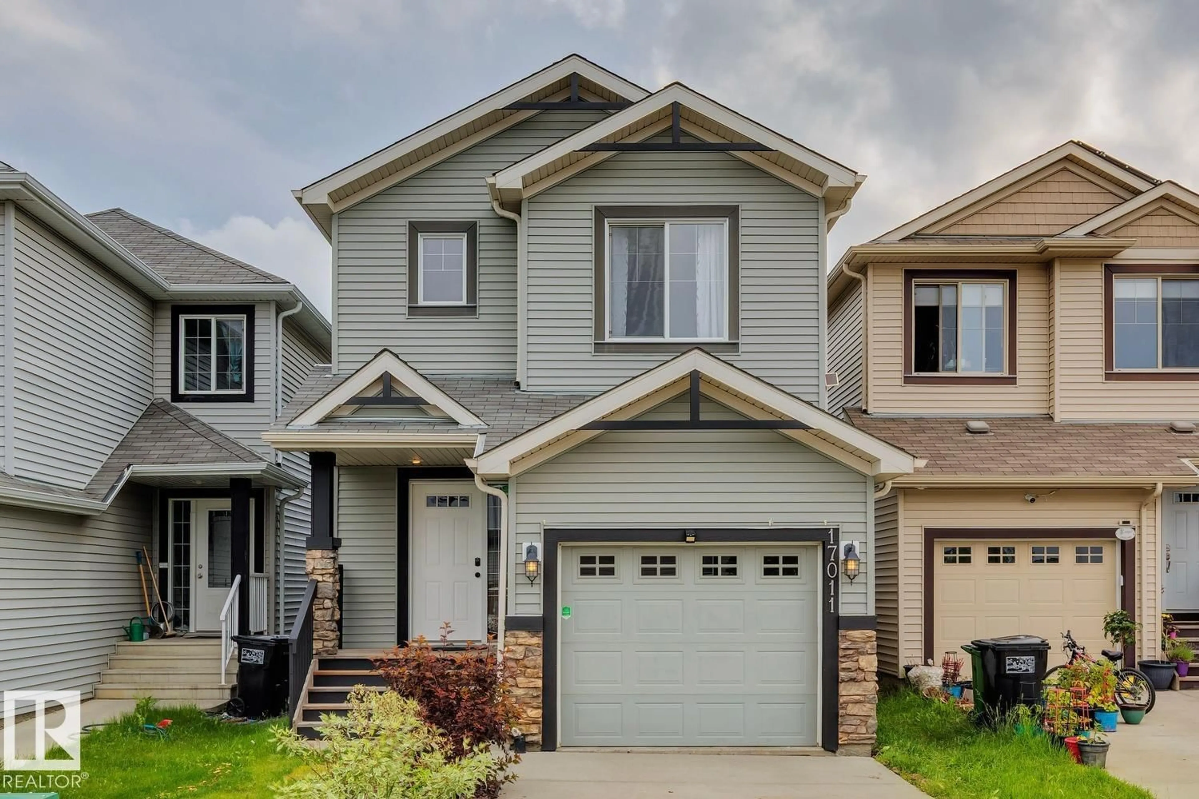 Home with vinyl exterior material, street for 17011 38 ST, Edmonton Alberta T5Y3S2