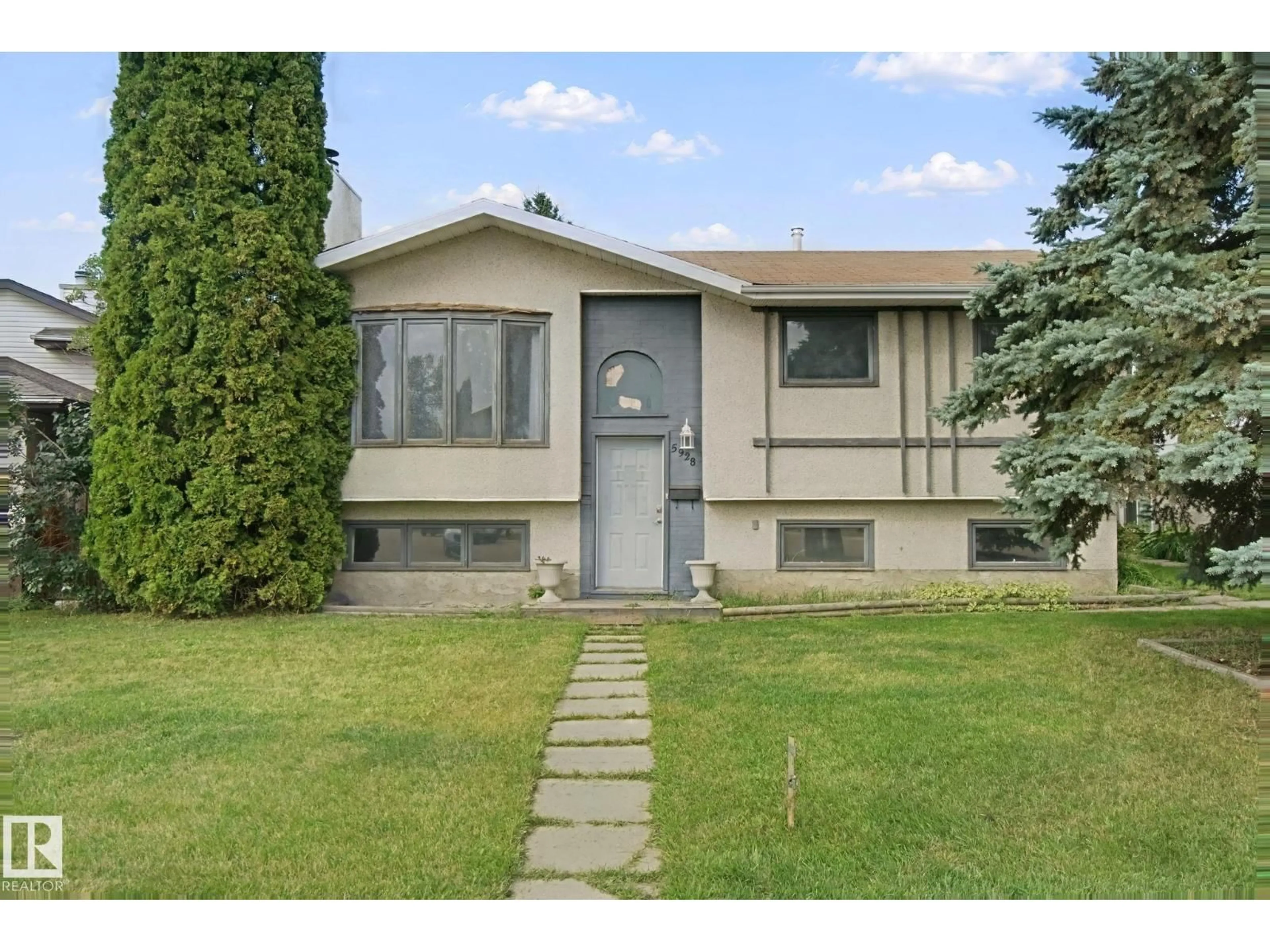 Home with vinyl exterior material, street for NW - 5928 11 AV, Edmonton Alberta T6L3A6