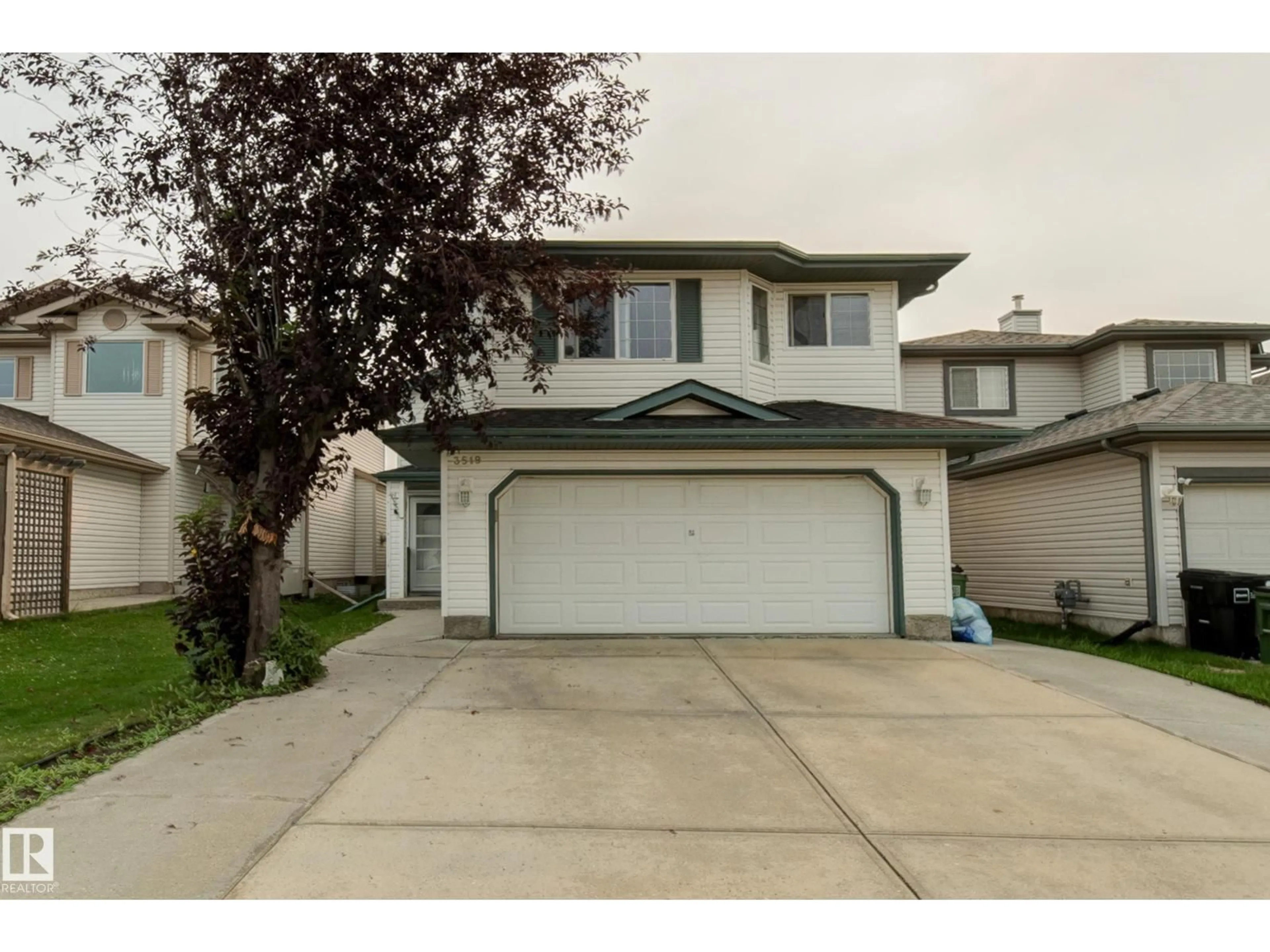 Home with vinyl exterior material, street for 3519 22 ST, Edmonton Alberta T6T1W2