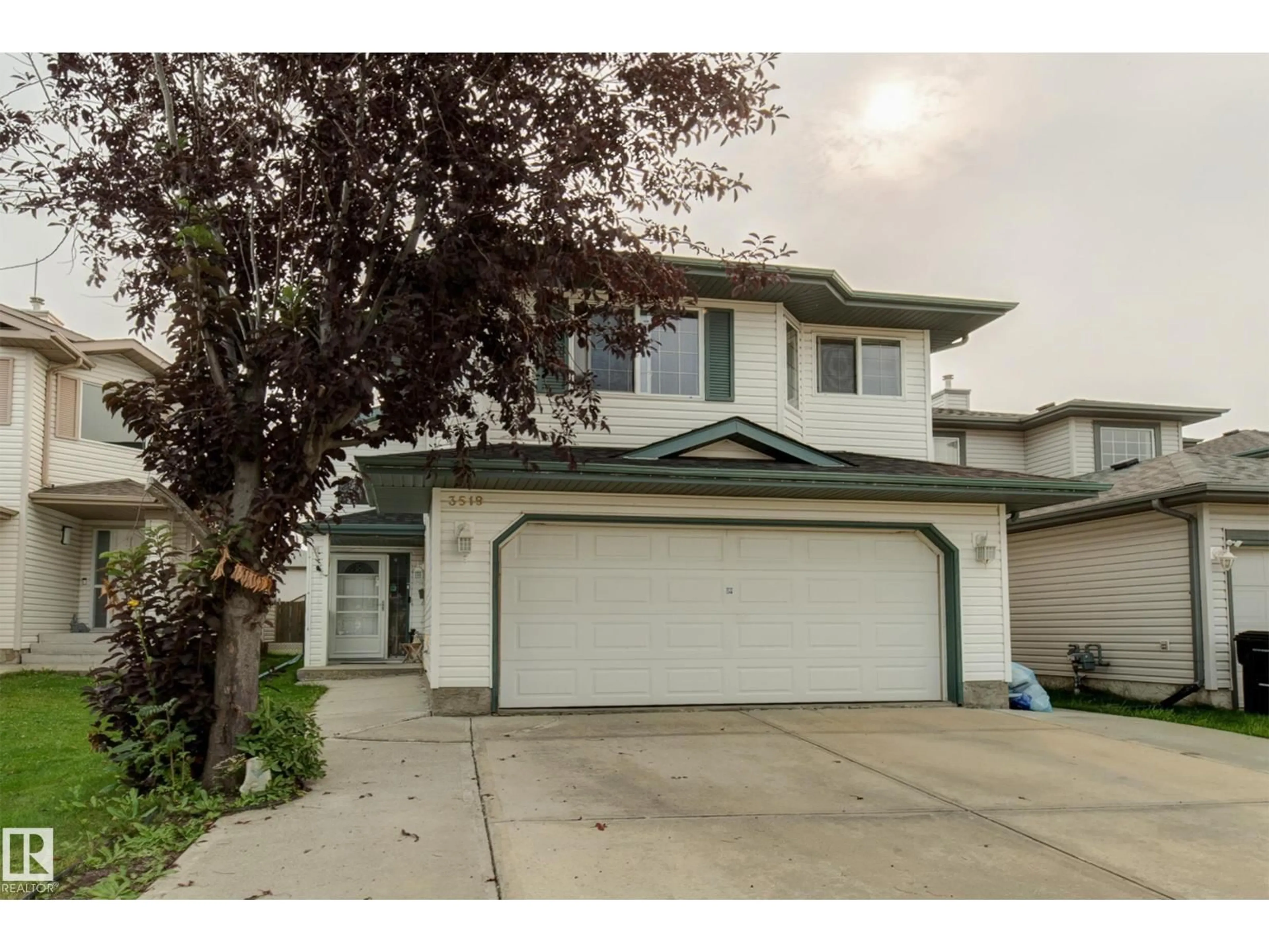 Home with vinyl exterior material, street for 3519 22 ST, Edmonton Alberta T6T1W2