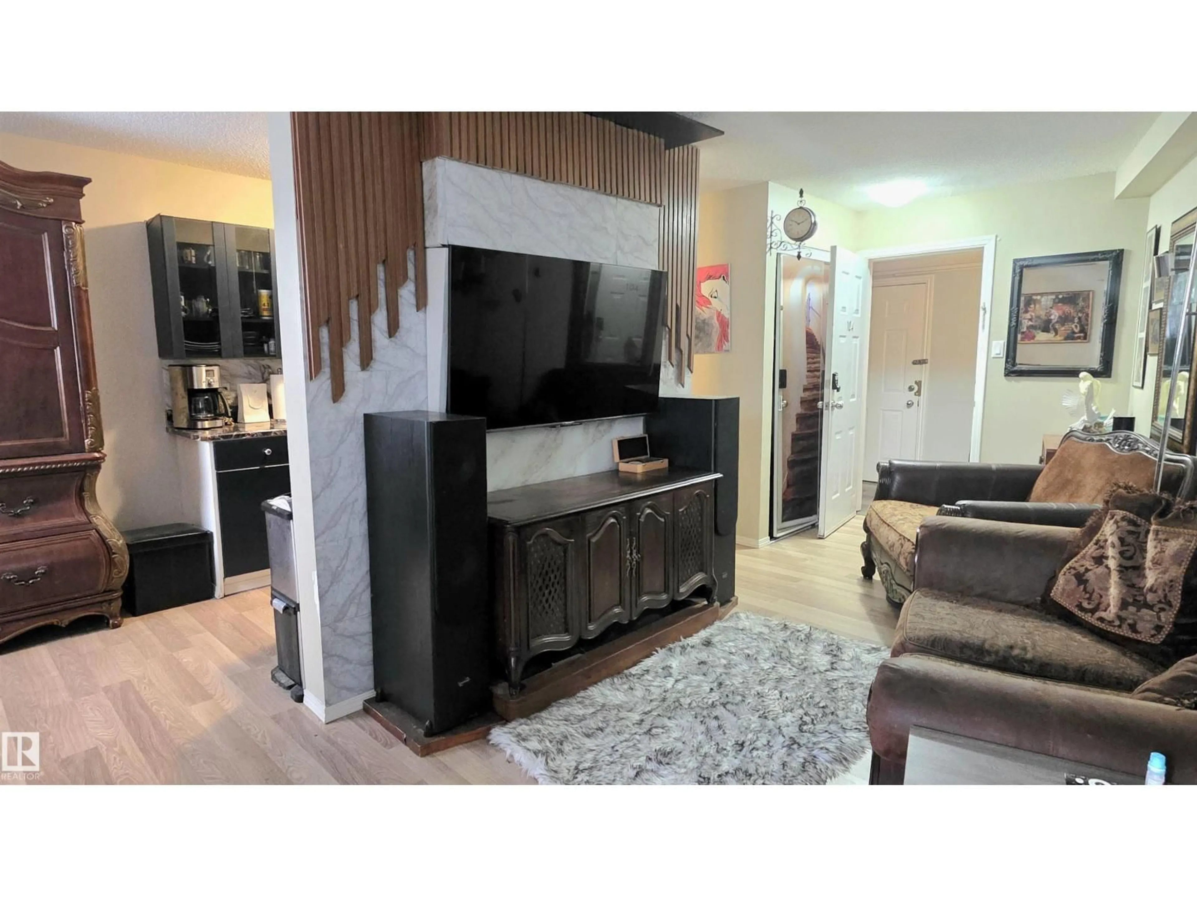 Living room with furniture, wood/laminate floor for #104 - 8930 149 ST, Edmonton Alberta T5R1B8